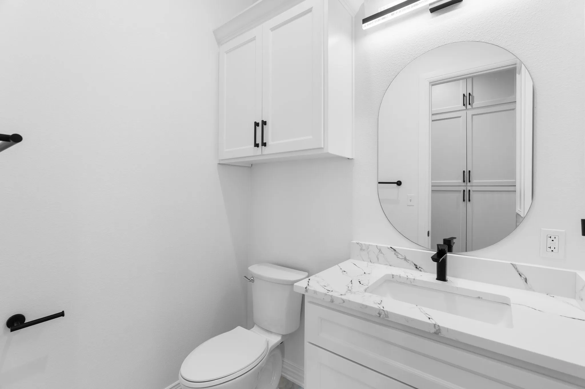 Half bath with vanity and toilet