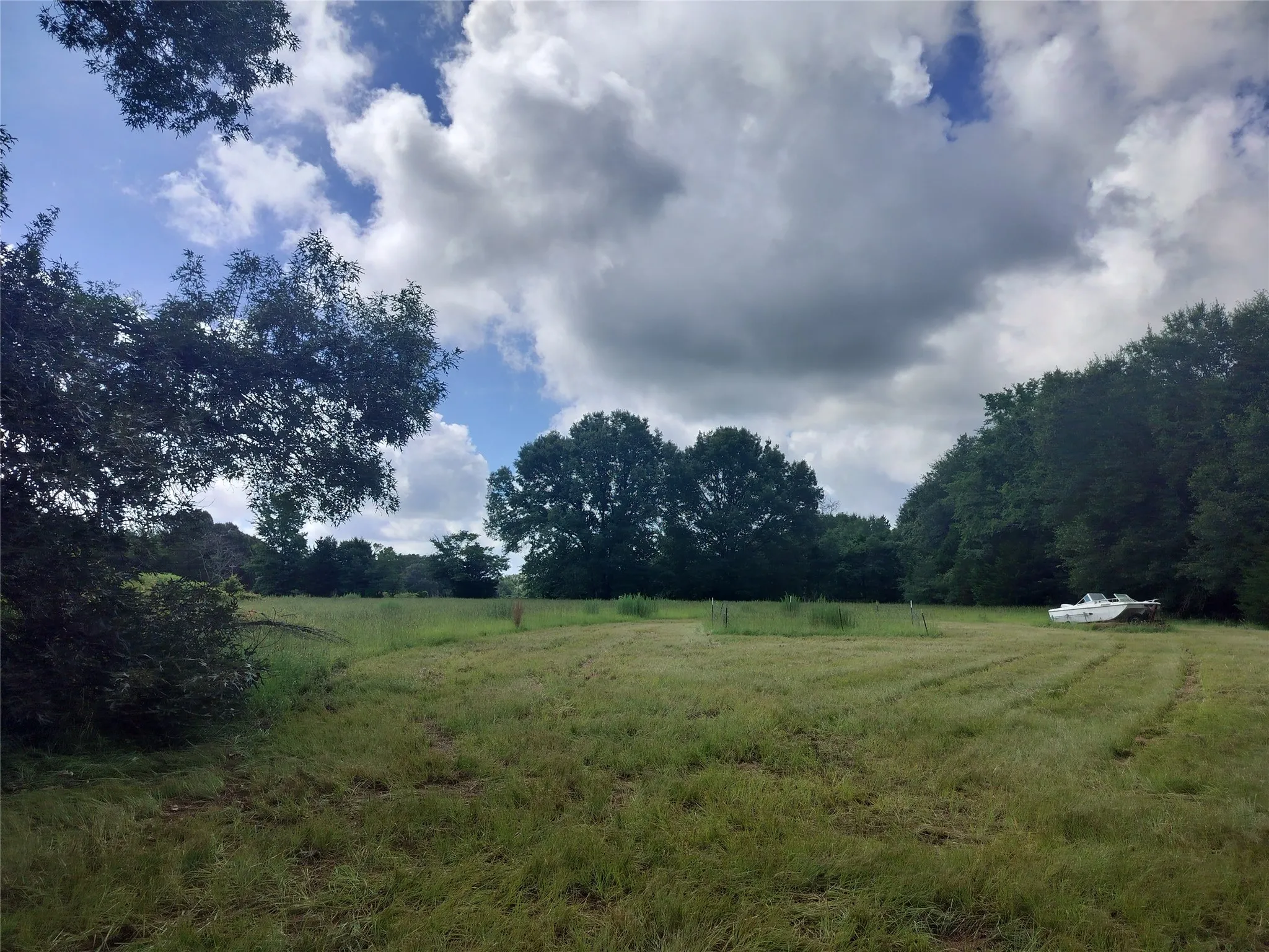 View of yard with a rural view