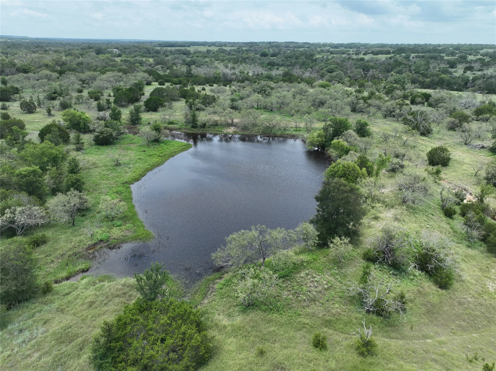 Aerial view of property's location featuring a nearby body of water