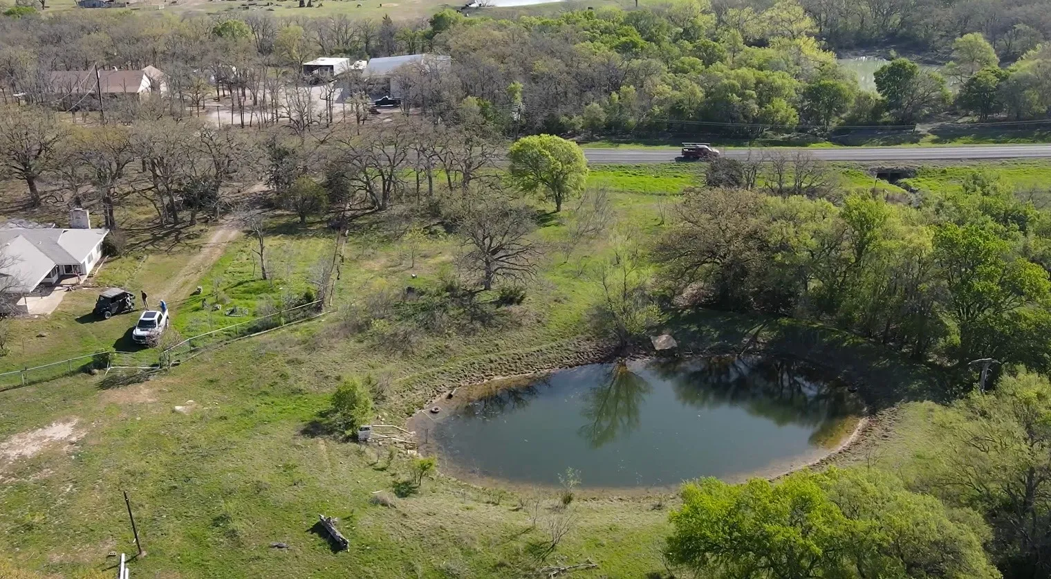 Overview of rural landscape with a nearby body of water