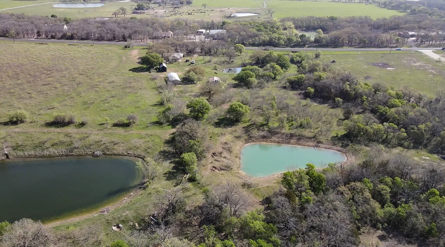 Aerial view of property and surrounding area with rural landscape