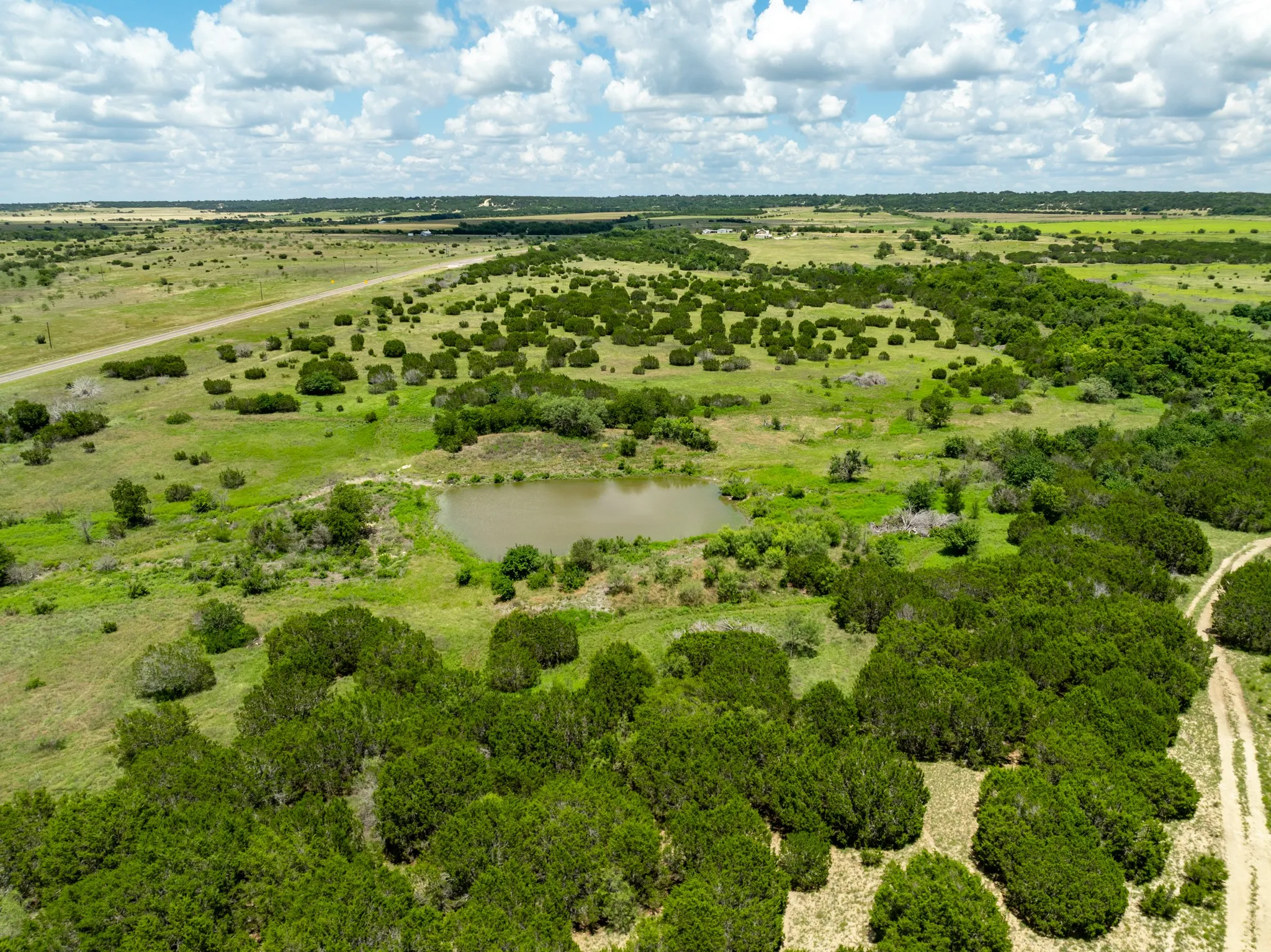 Aerial view of sparsely populated area with a nearby body of water