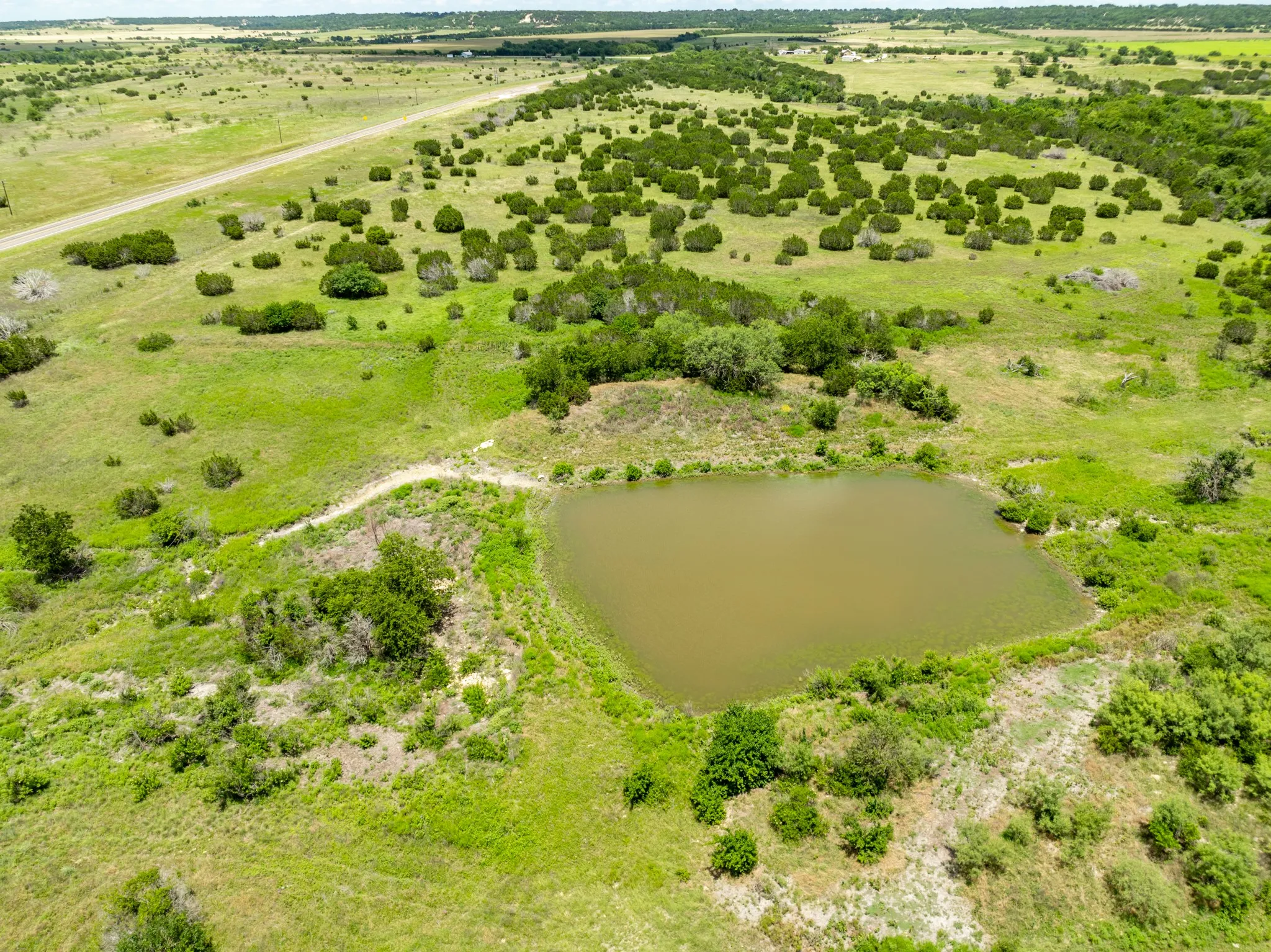 Aerial view of sparsely populated area featuring a large body of water
