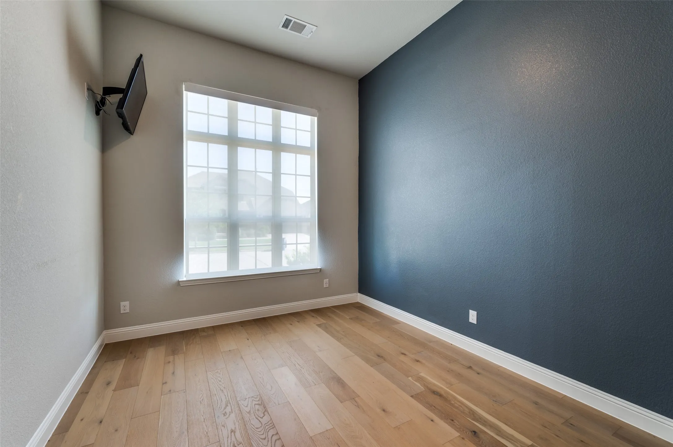 Office with ample amount of natural light and light wood finished floors
