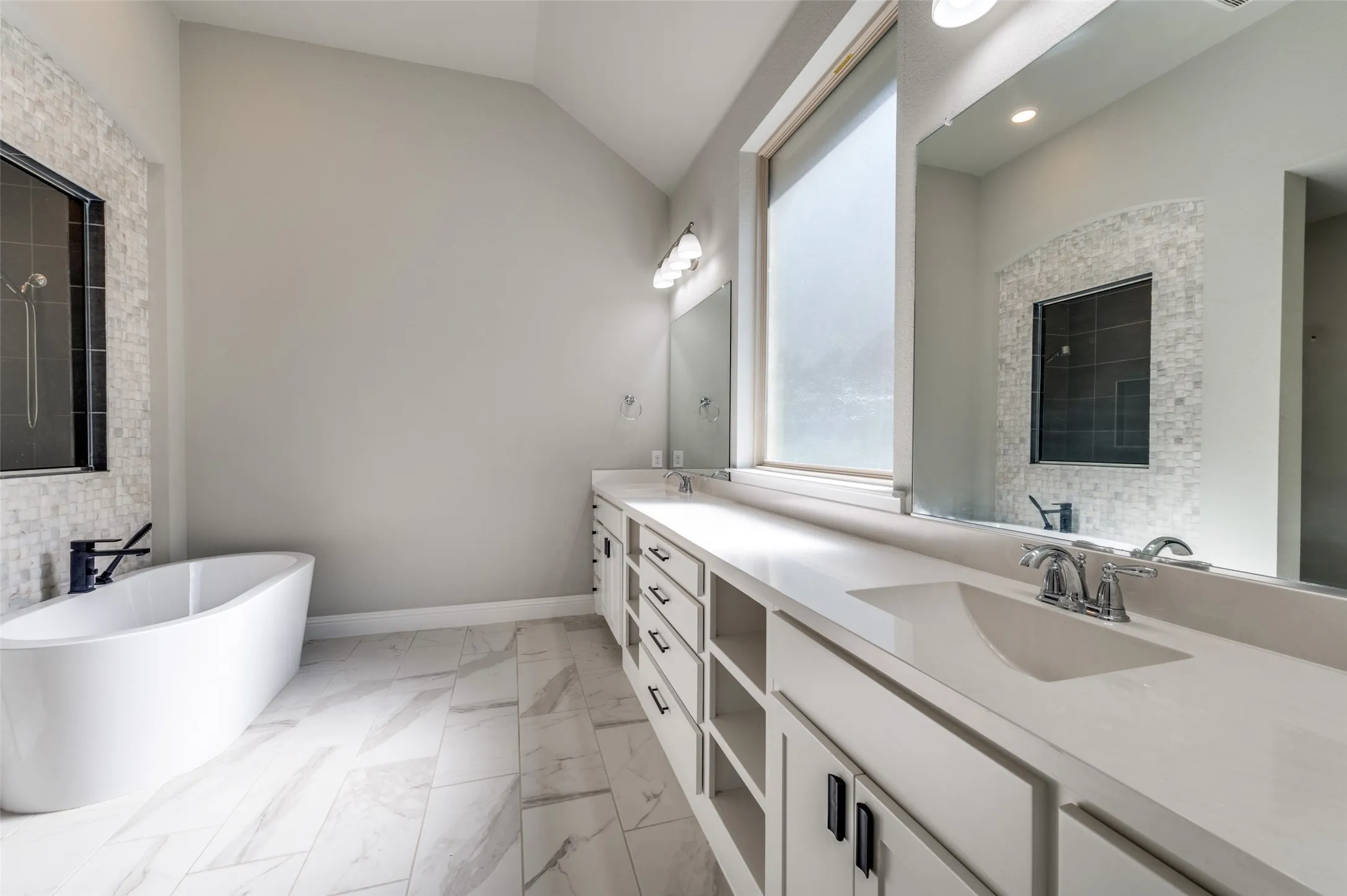 Master Bathroom featuring a soaking tub, shower, water closet, double vanity, lofted ceiling, and recessed lighting