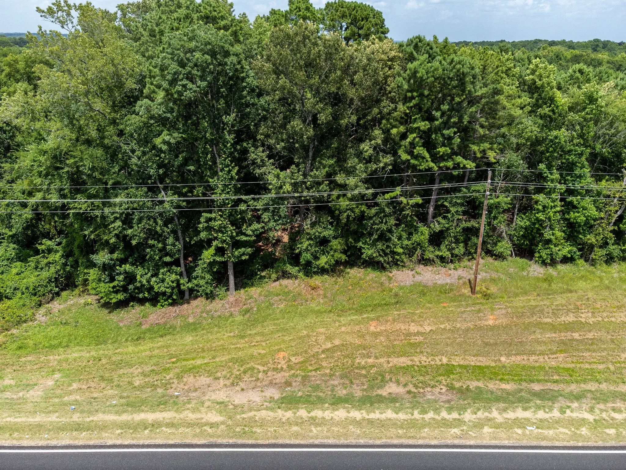 View of yard with a wooded view