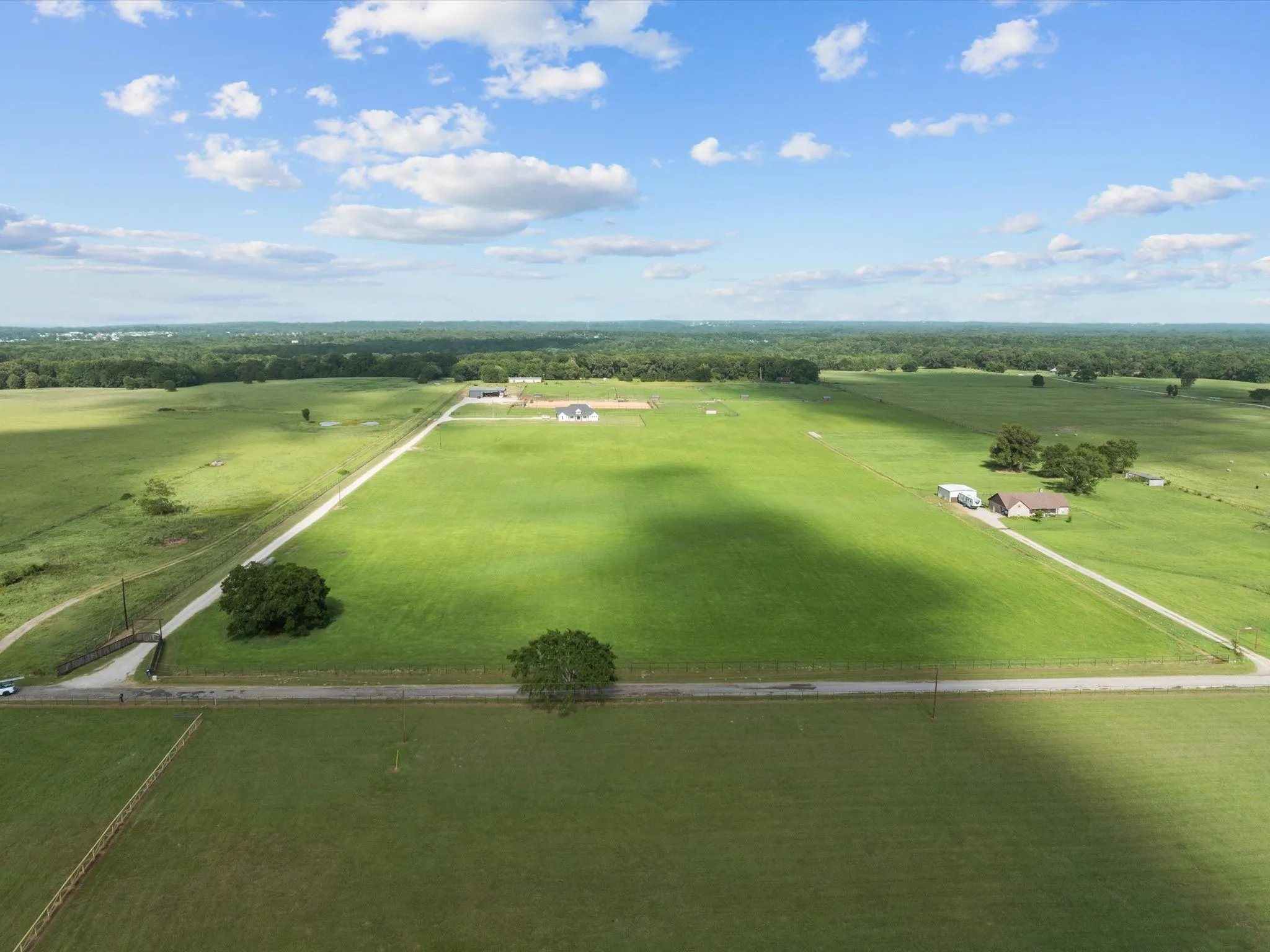 Aerial view of sparsely populated area featuring a pastoral area