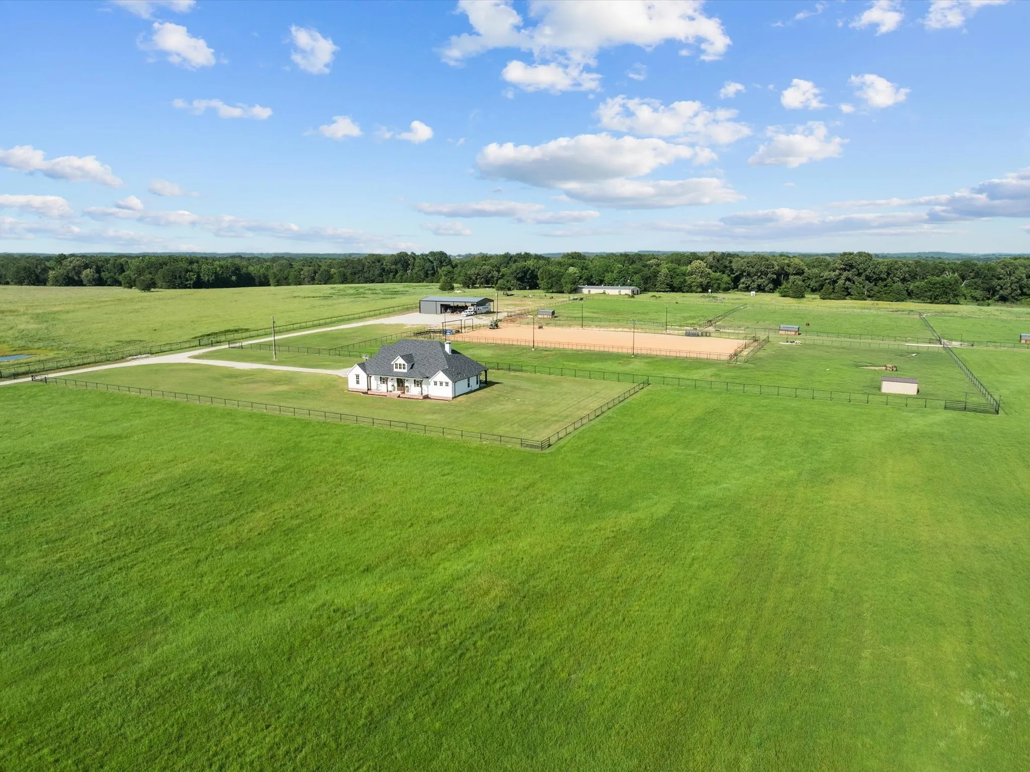 Aerial view of sparsely populated area featuring a pastoral area