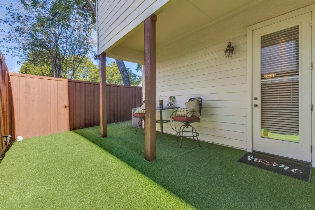 Fenced backyard with a patio area