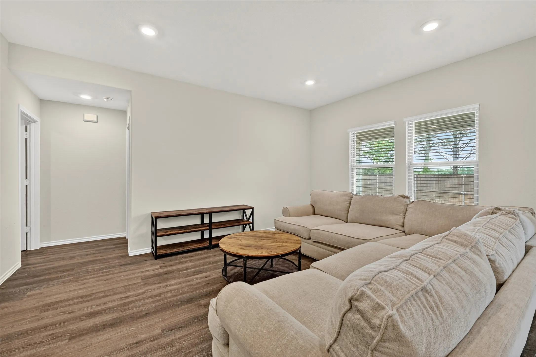Living room featuring wood finished floors and recessed lighting
