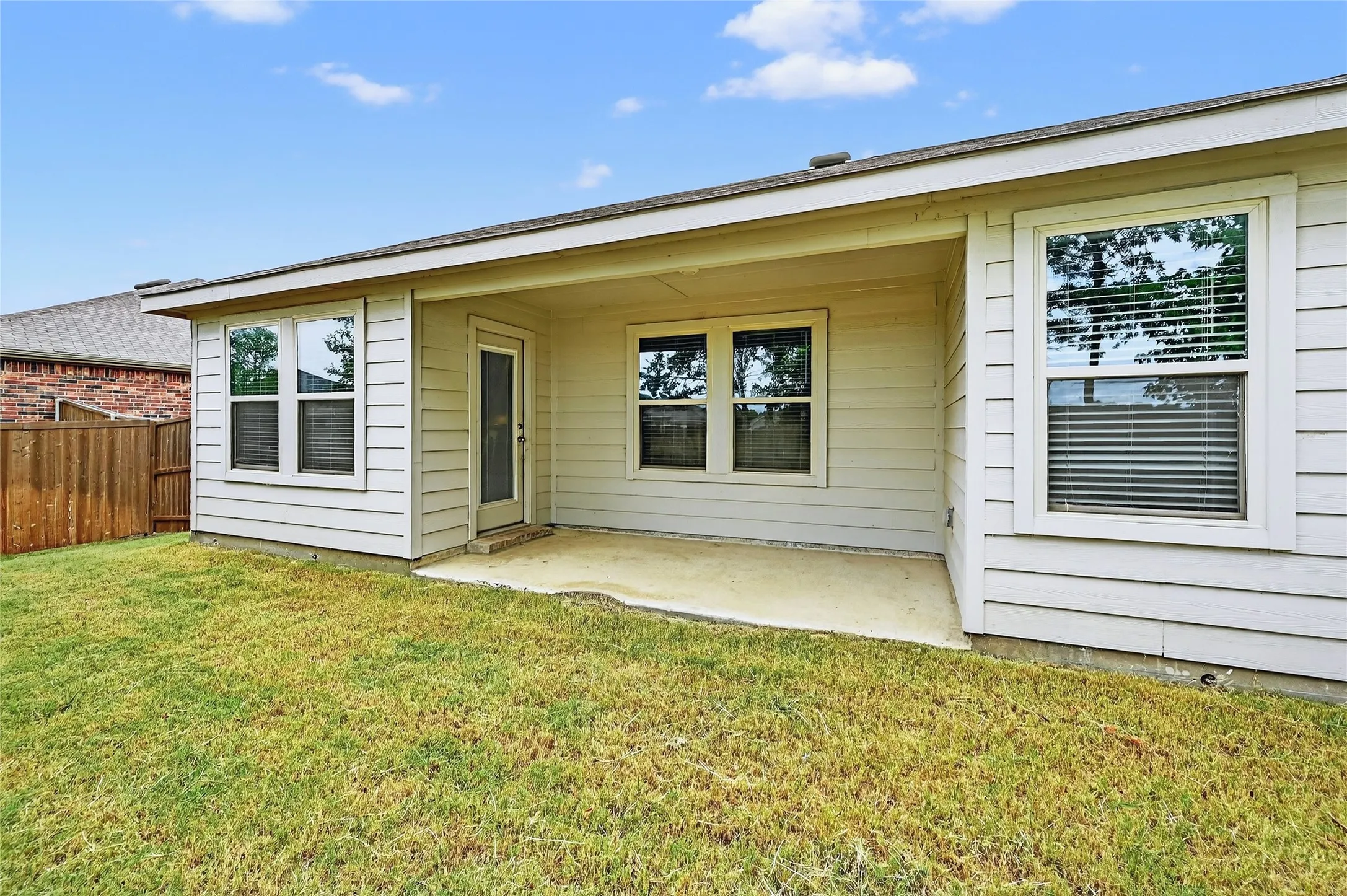 Rear view of house featuring a patio