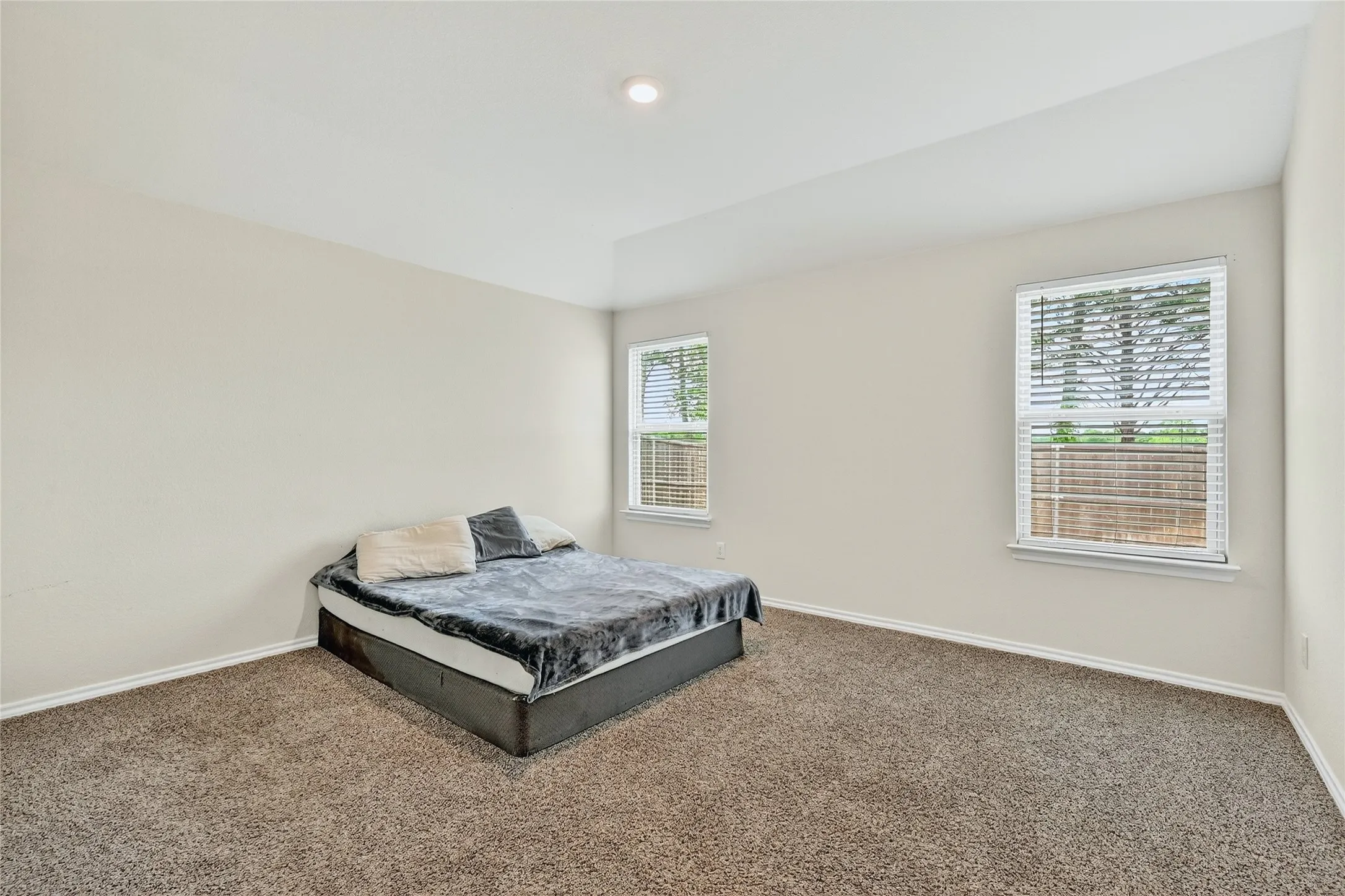 Bedroom with carpet and baseboards