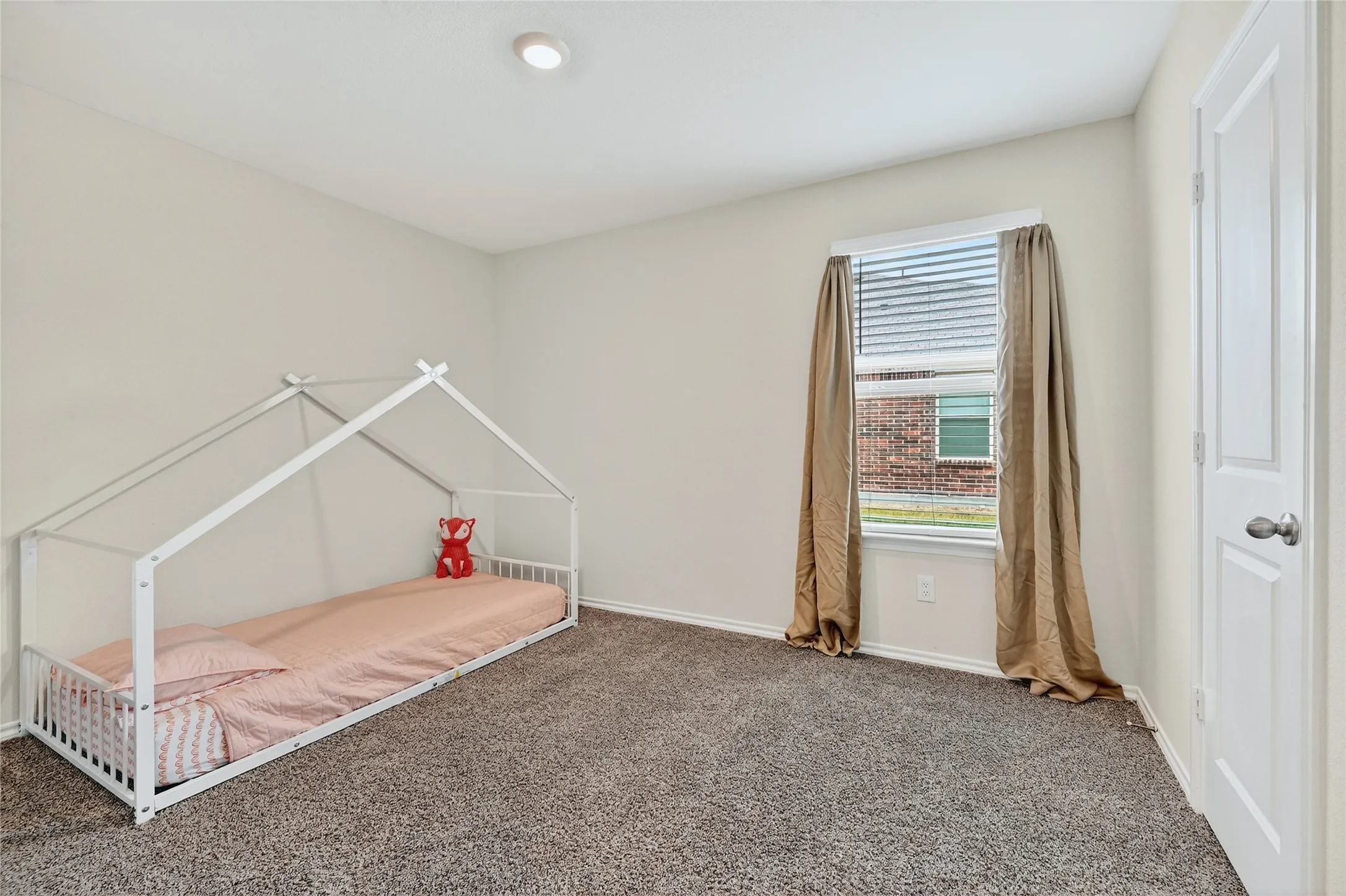 Unfurnished bedroom with carpet flooring
