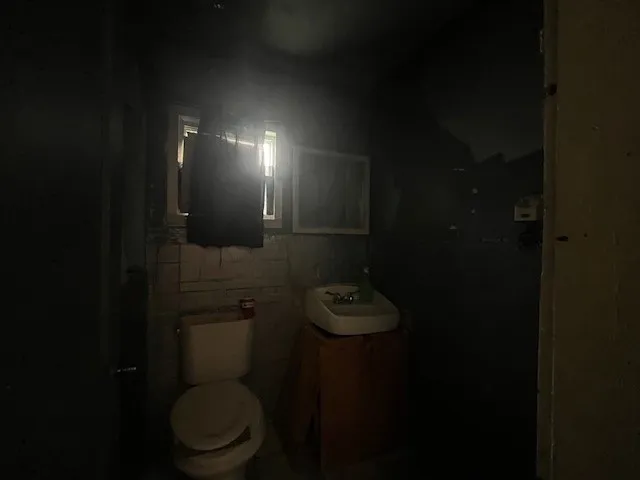 Bathroom with toilet and vanity