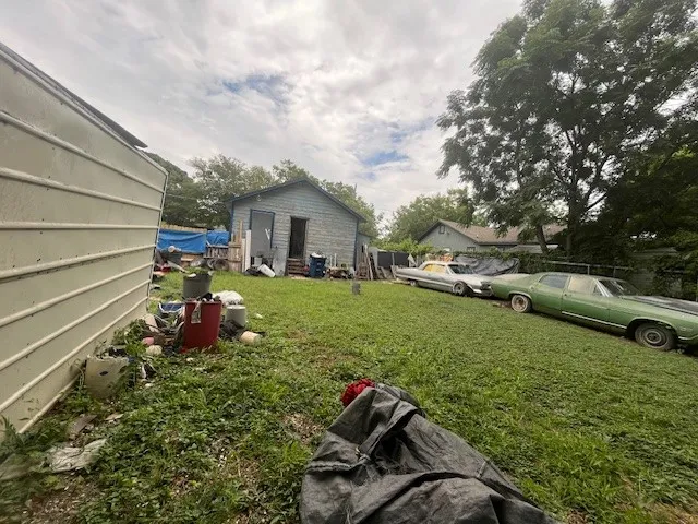 View of green lawn with an outbuilding
