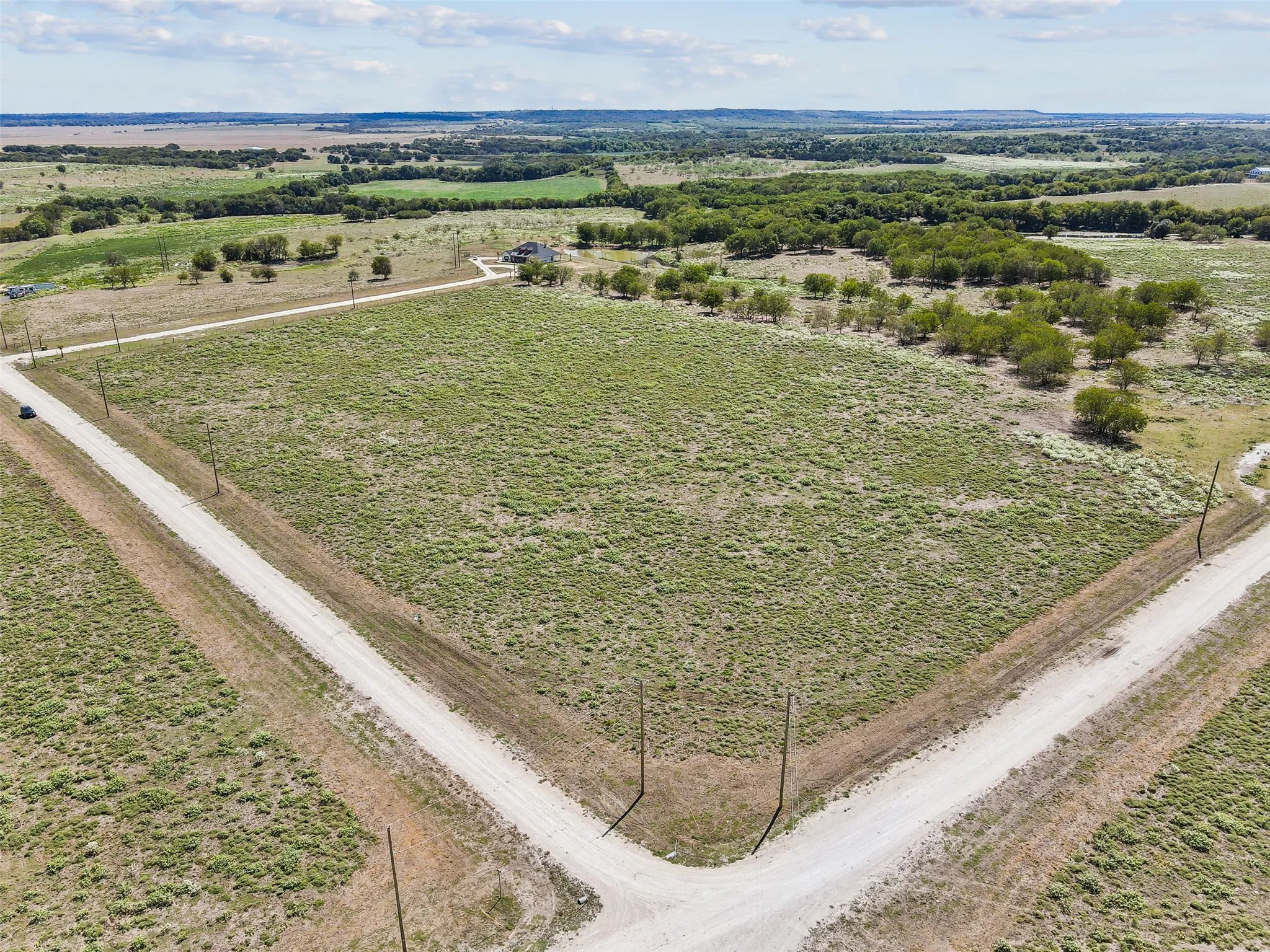 Birds eye view of property featuring a rural view