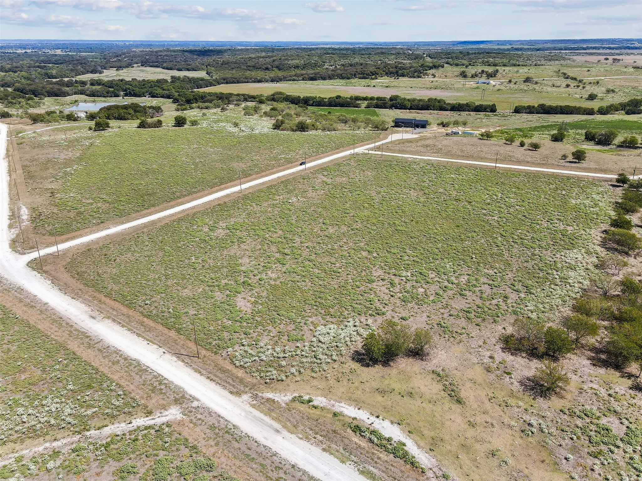 Birds eye view of property with a rural view