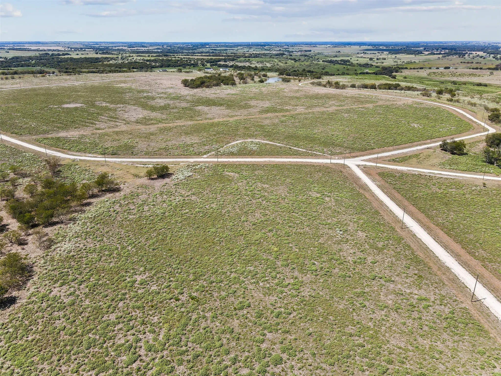 Birds eye view of property with a rural view