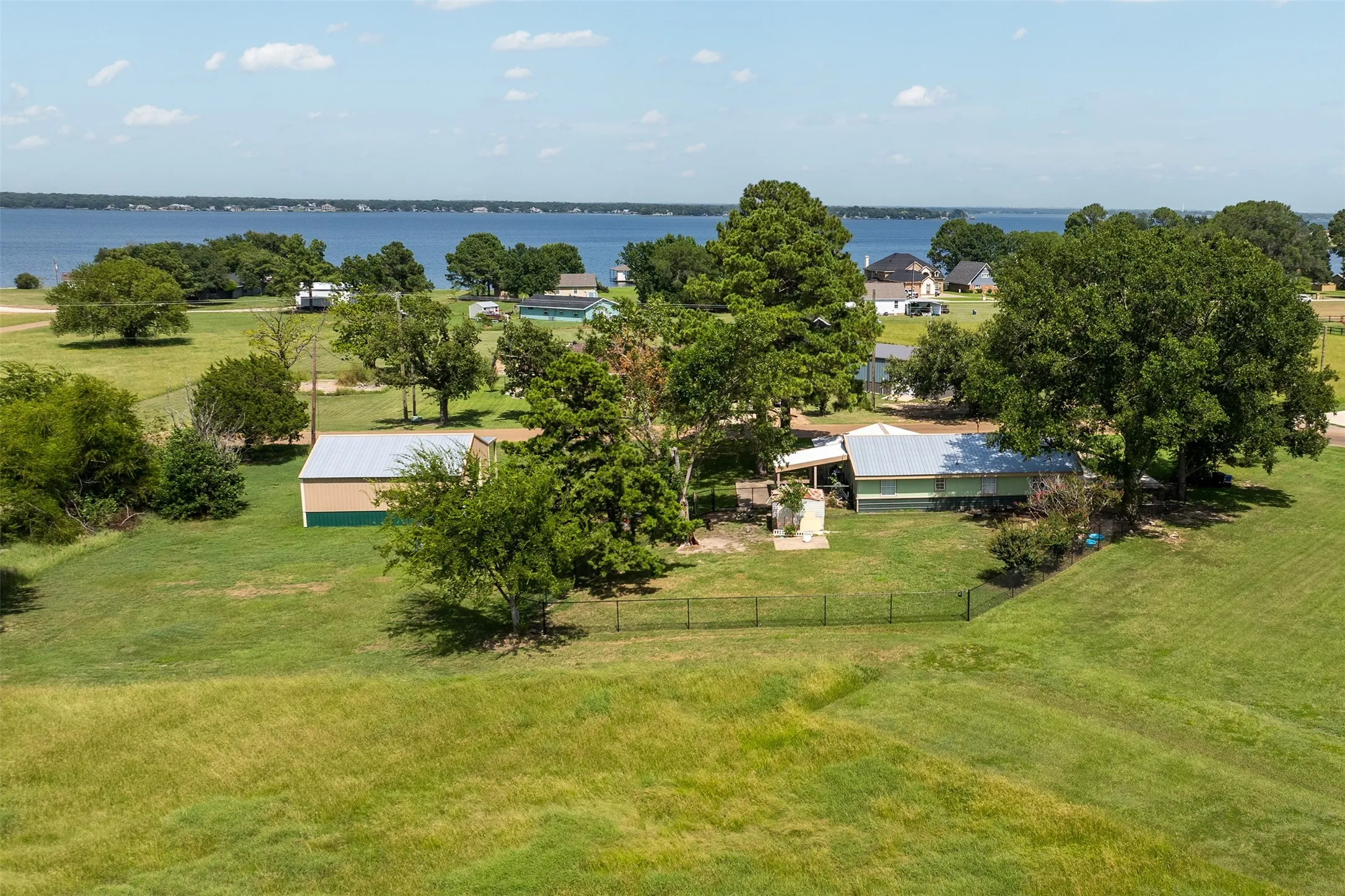 View from above of property with a large body of water