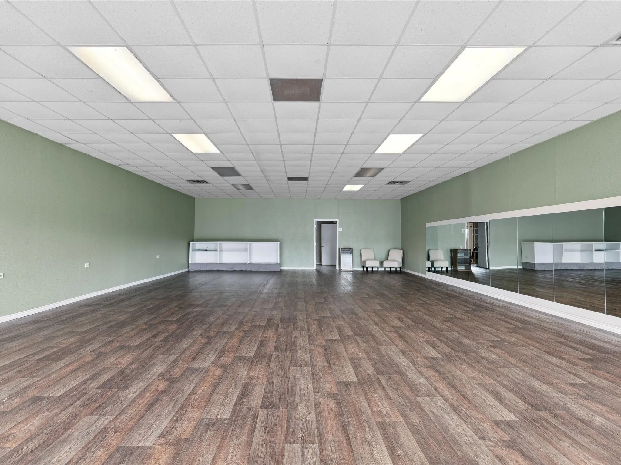 Spare room featuring wood finished floors and baseboards