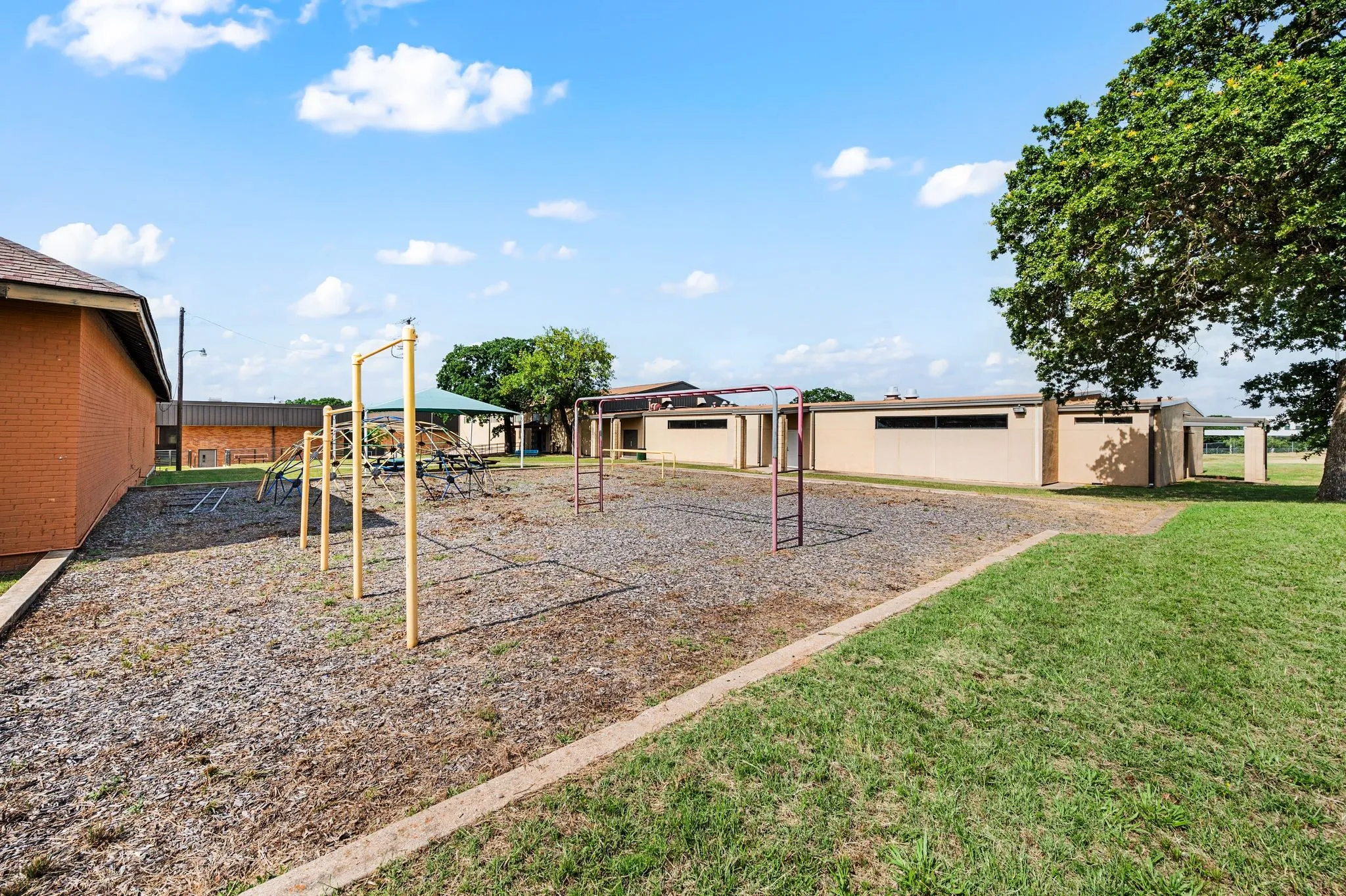View of playground featuring a lawn