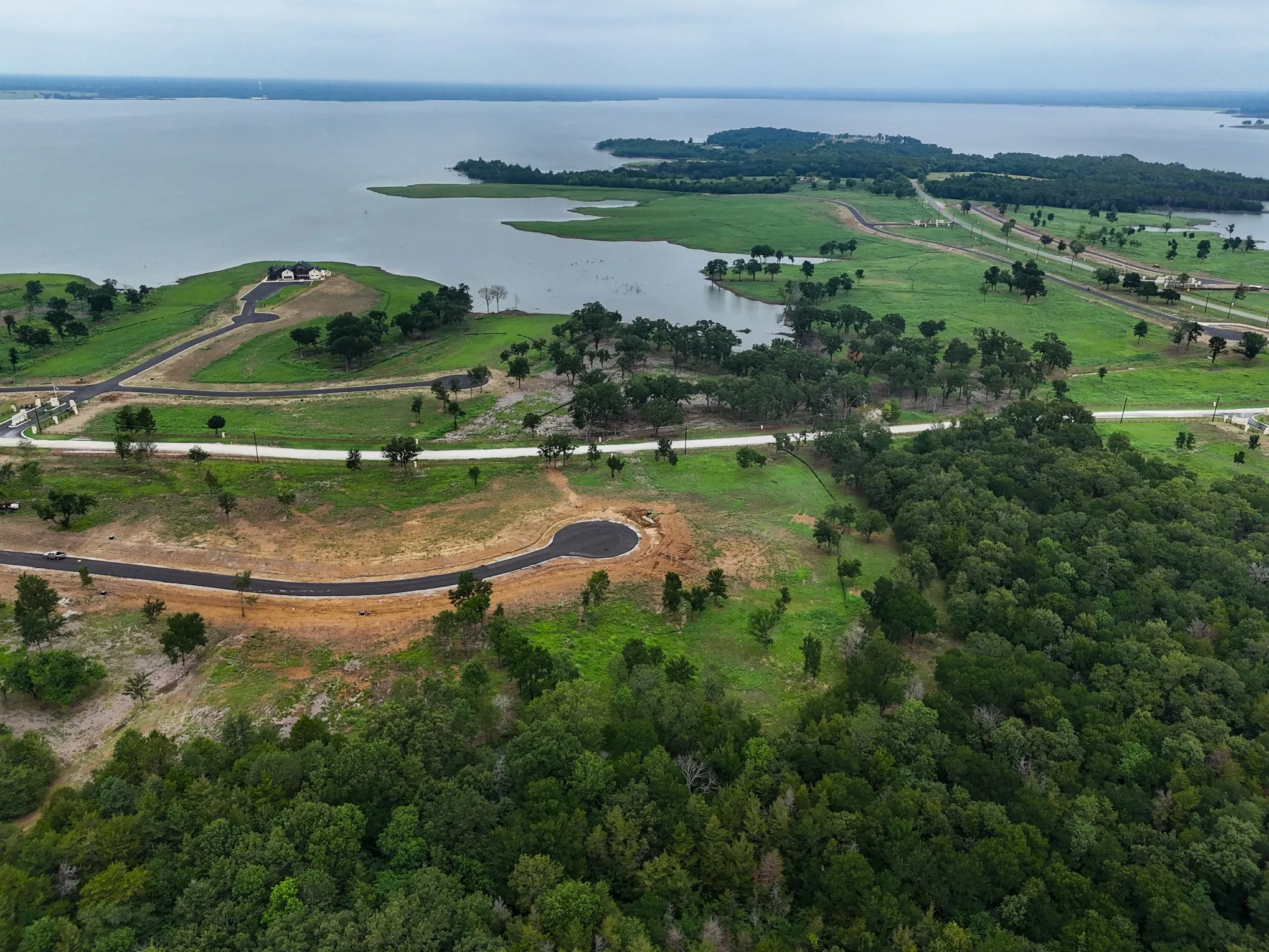 Aerial overview of property's location featuring a nearby body of water
