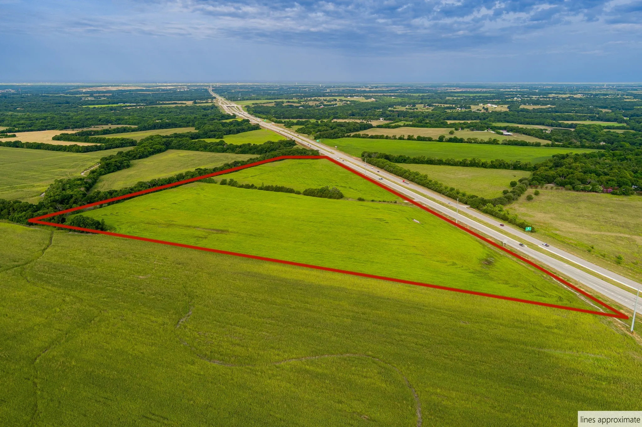 Aerial view of sparsely populated area with property boundaries highlighted and a pastoral area