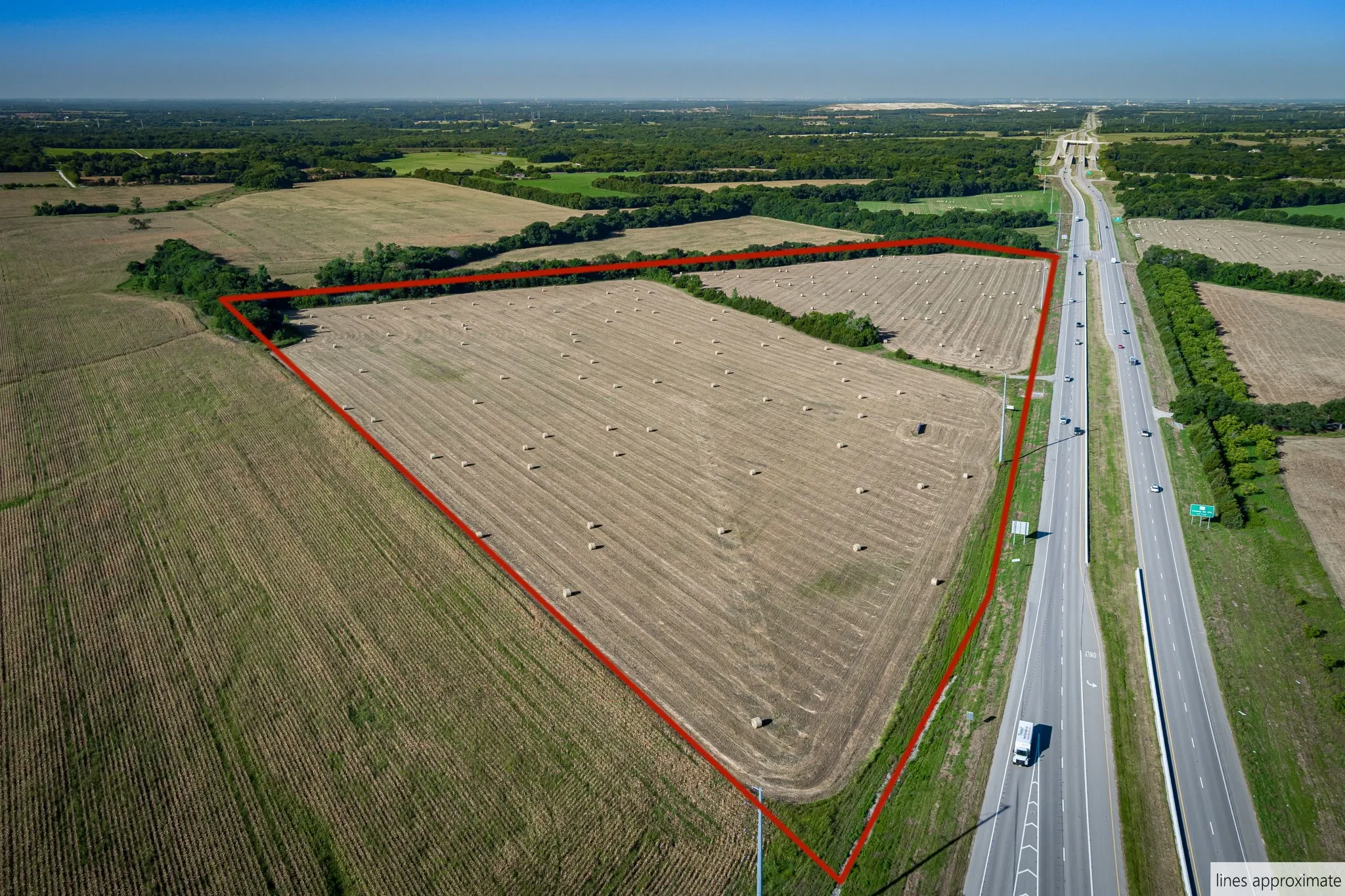 View of rural area with property boundaries highlighted and large plots for crops