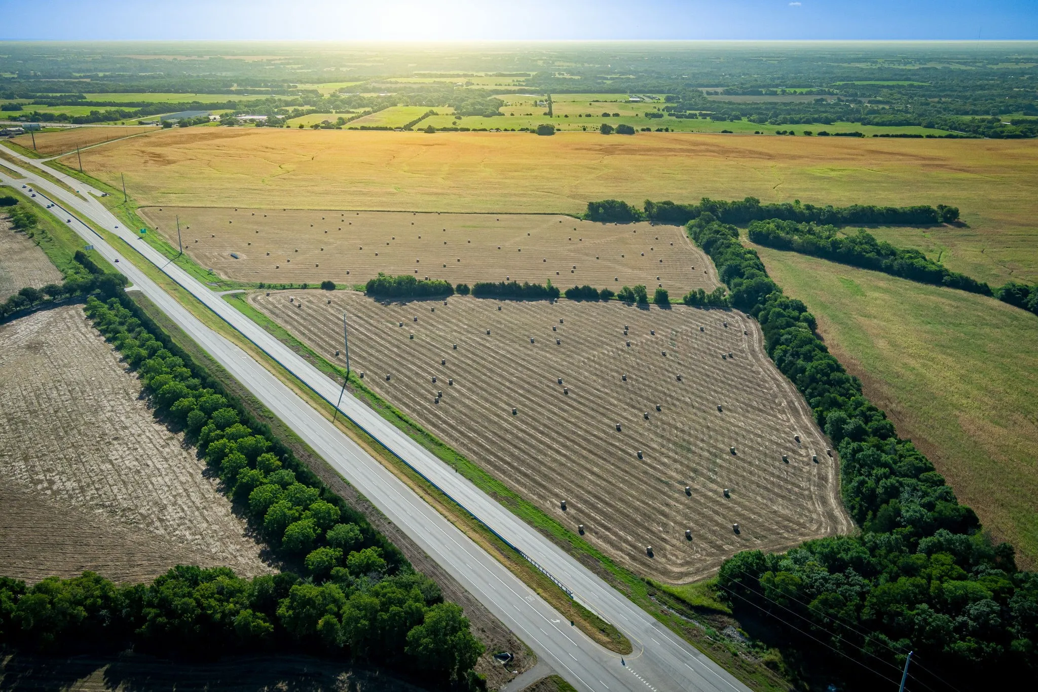 Aerial overview of property's location featuring rural landscape and abundant farmland