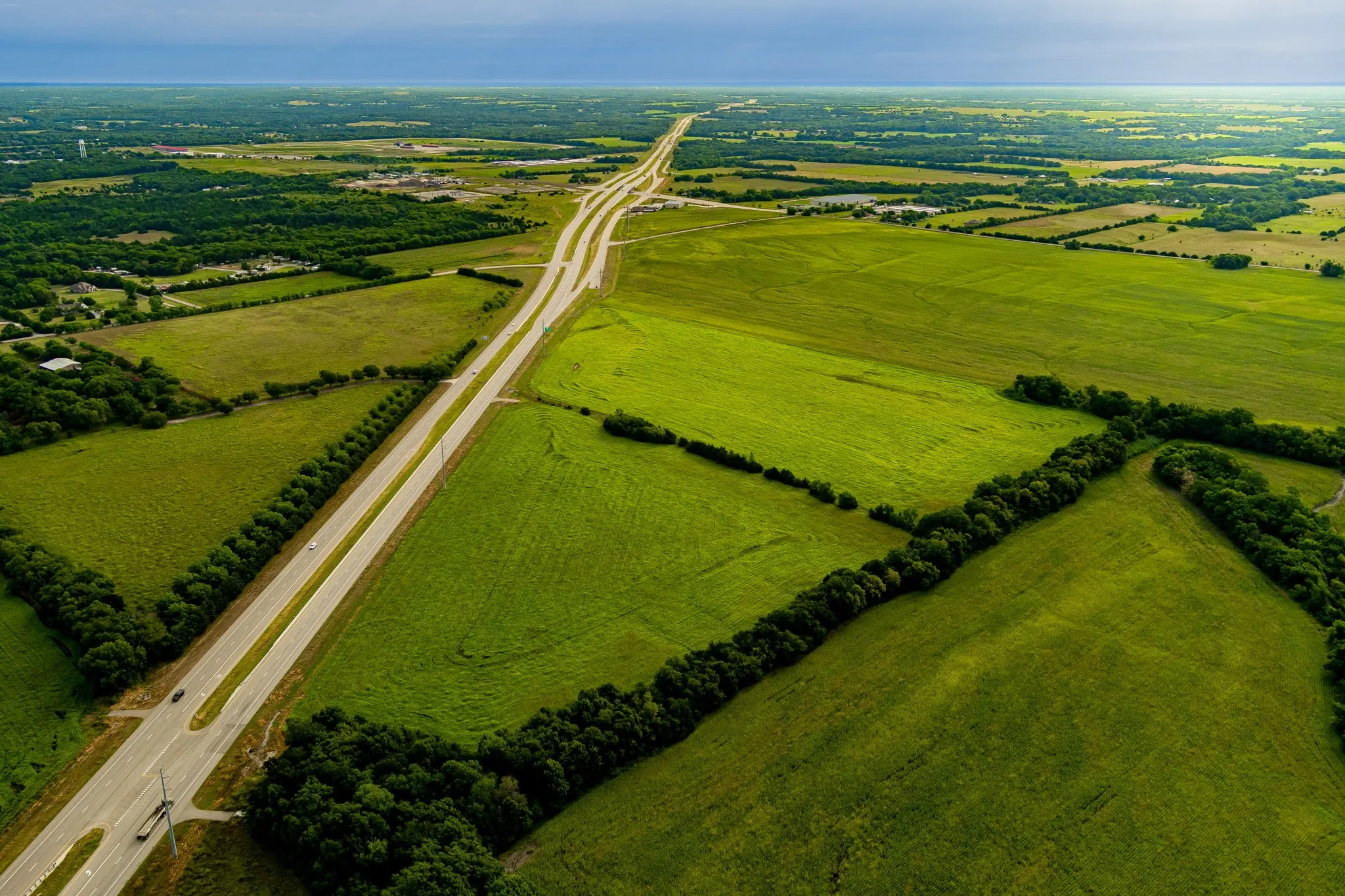 Aerial view of sparsely populated area with a main thoroughfare