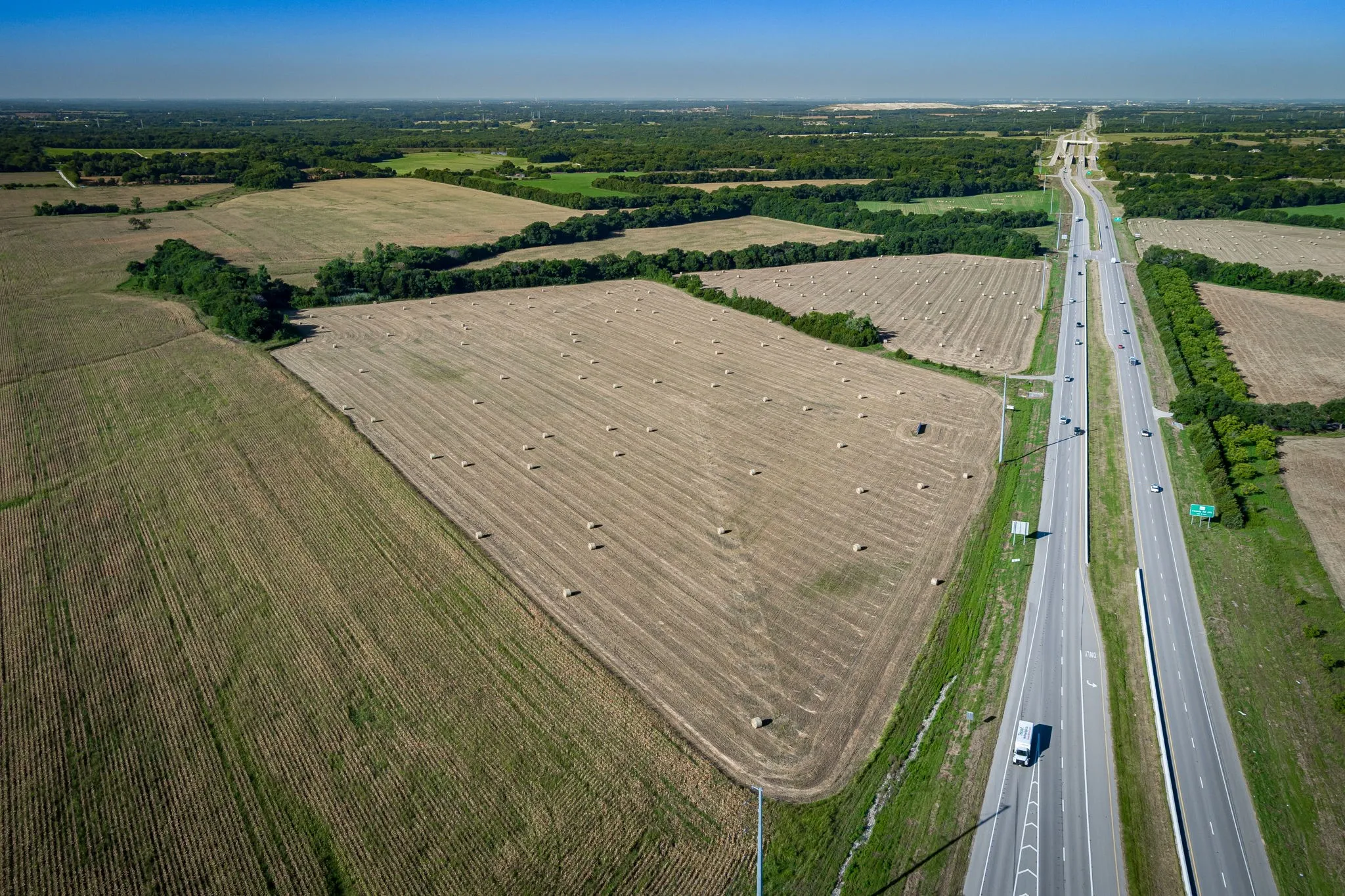 View of rural area featuring a major roadway and abundant farmland