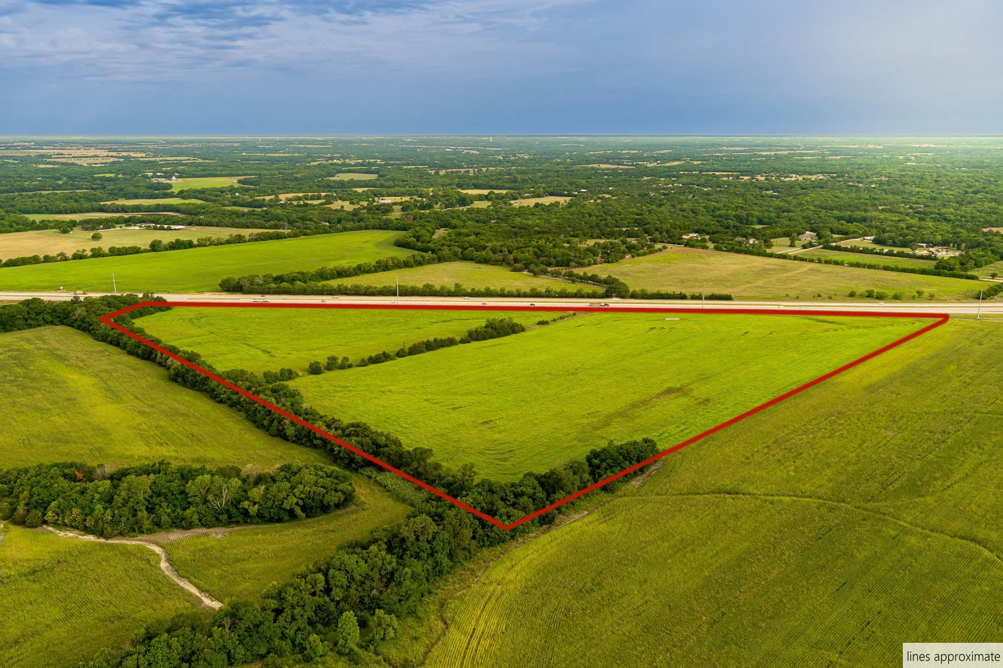 View of rural area featuring property parcel outlined and large plots for crops