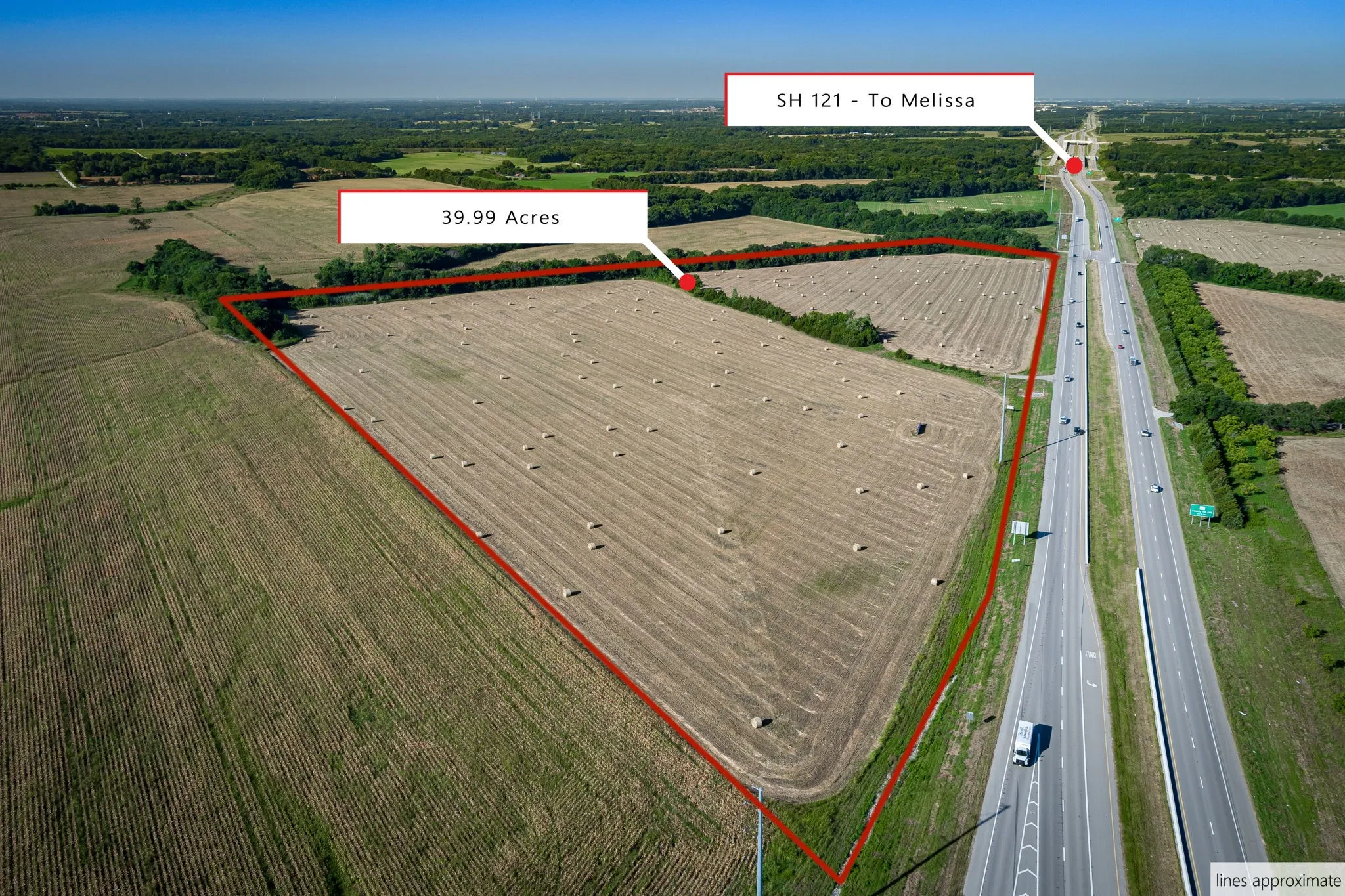 Aerial view of sparsely populated area featuring property boundaries highlighted and a highway