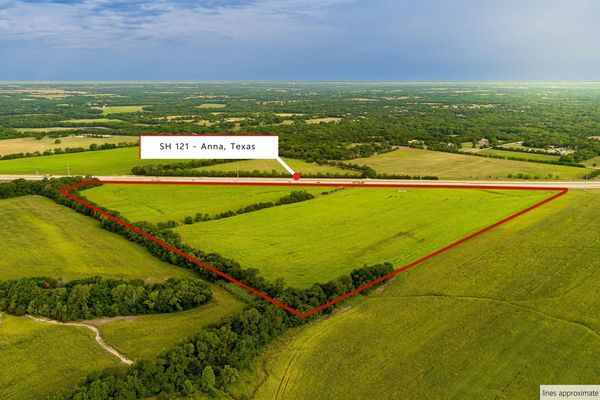 Aerial view of sparsely populated area with property boundaries highlighted and large plots for crops