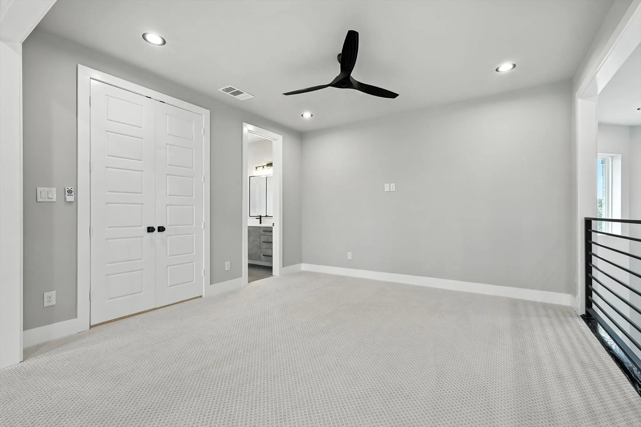 Unfurnished bedroom with carpet, recessed lighting, ceiling fan, ensuite bathroom, and a closet