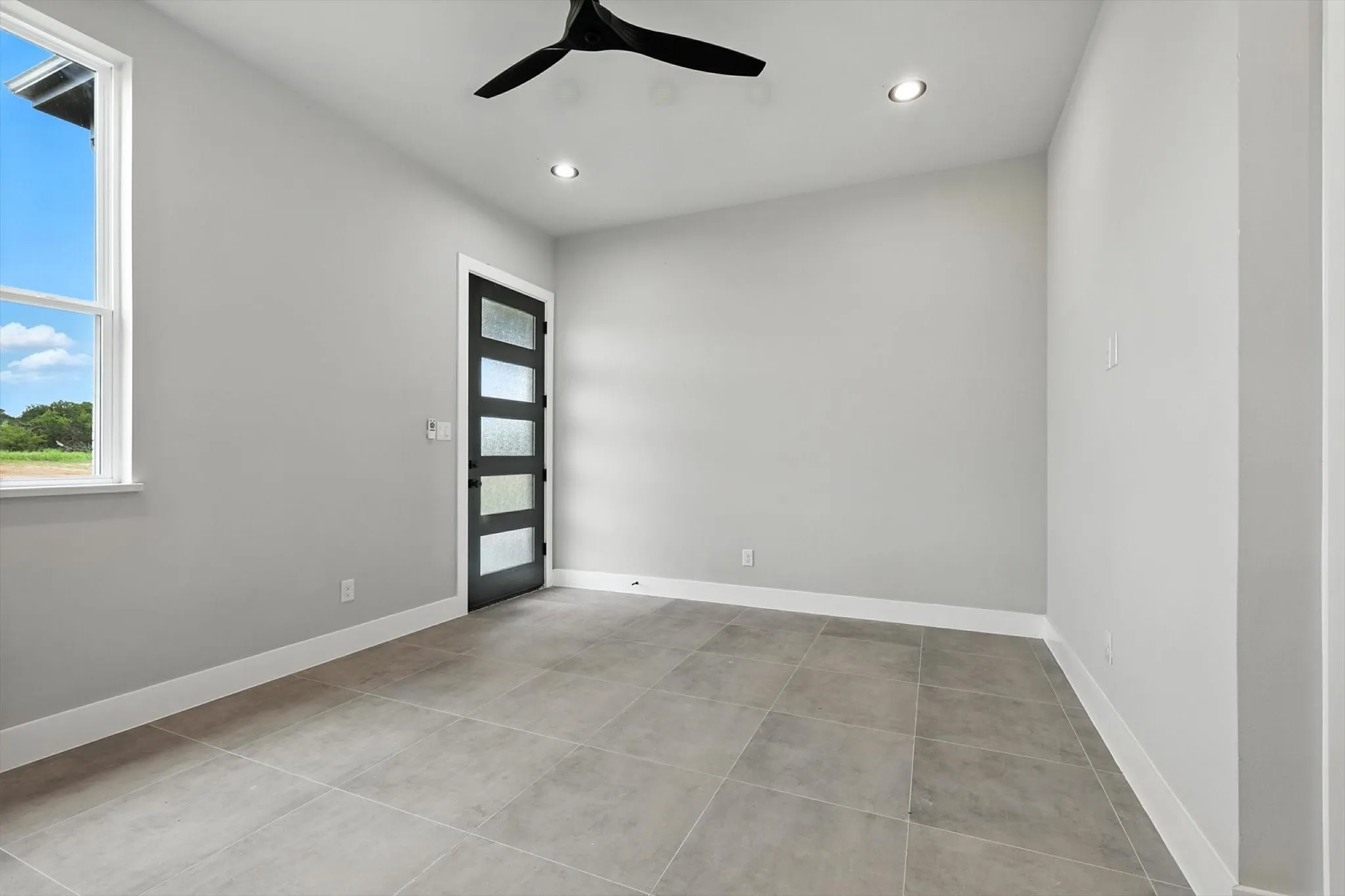 Unfurnished room featuring a ceiling fan, recessed lighting, and tile patterned floors