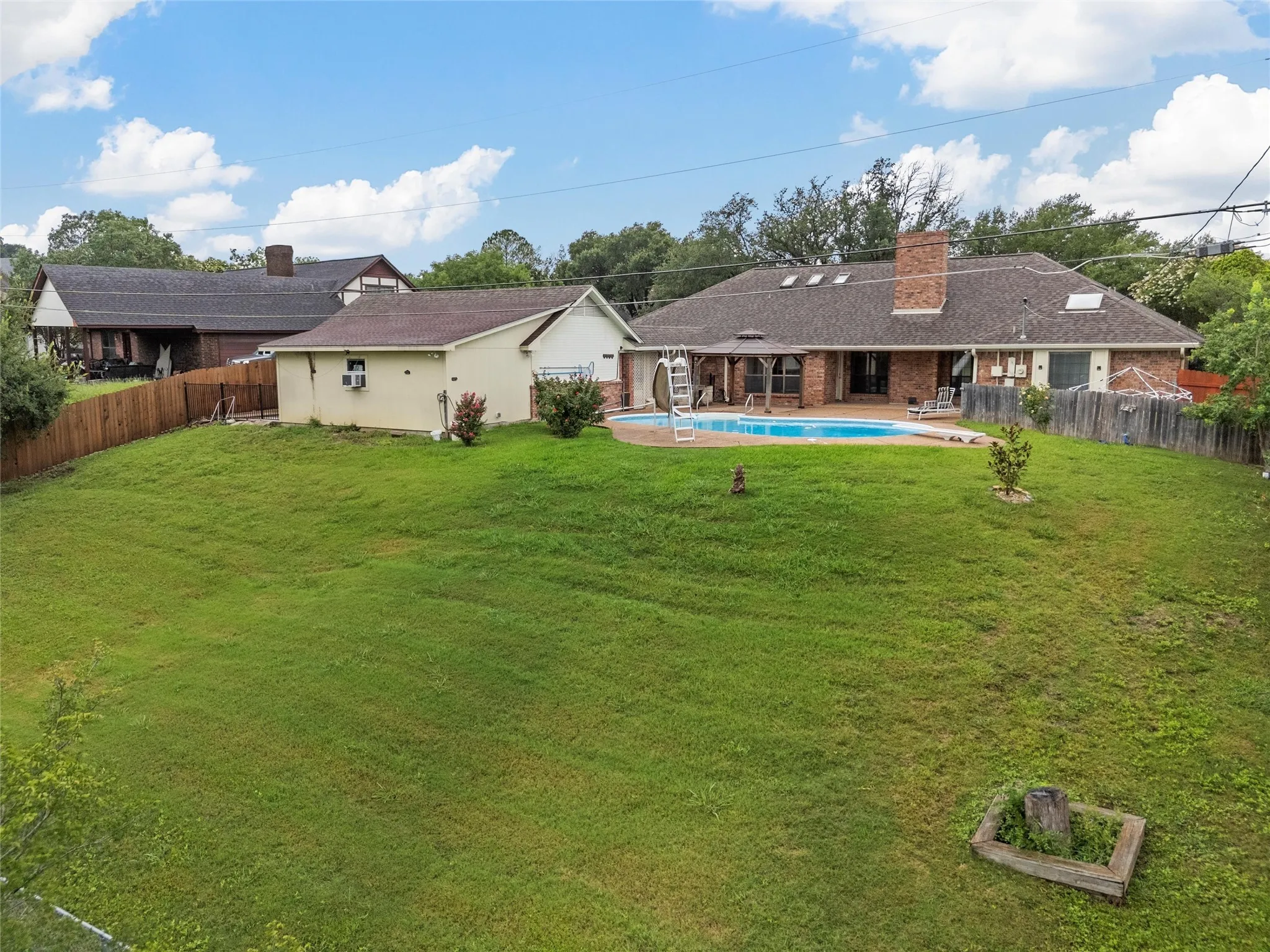 View of fenced backyard