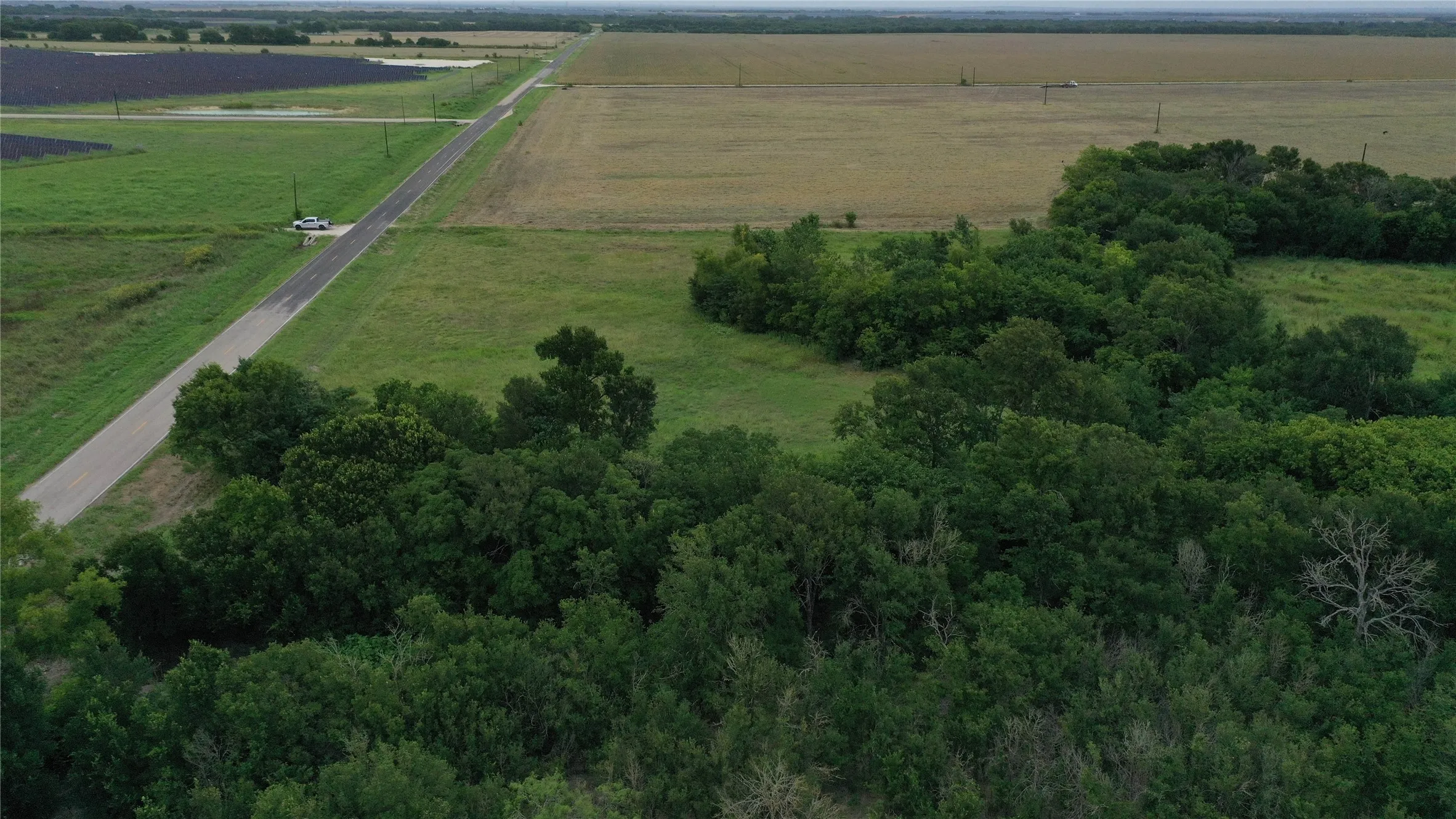 Aerial view of property's location featuring rural landscape and large plots for crops