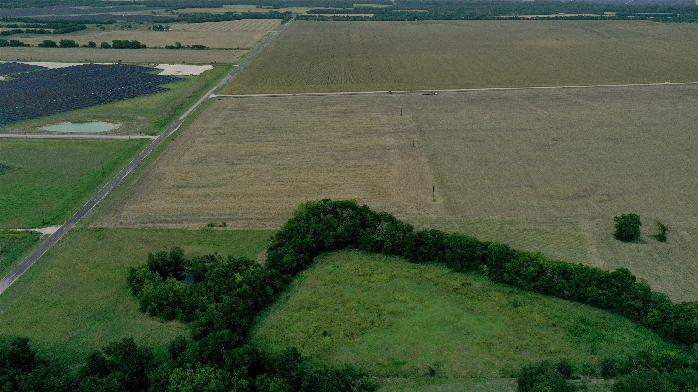 Aerial overview of property's location with extensive farmland and rural landscape