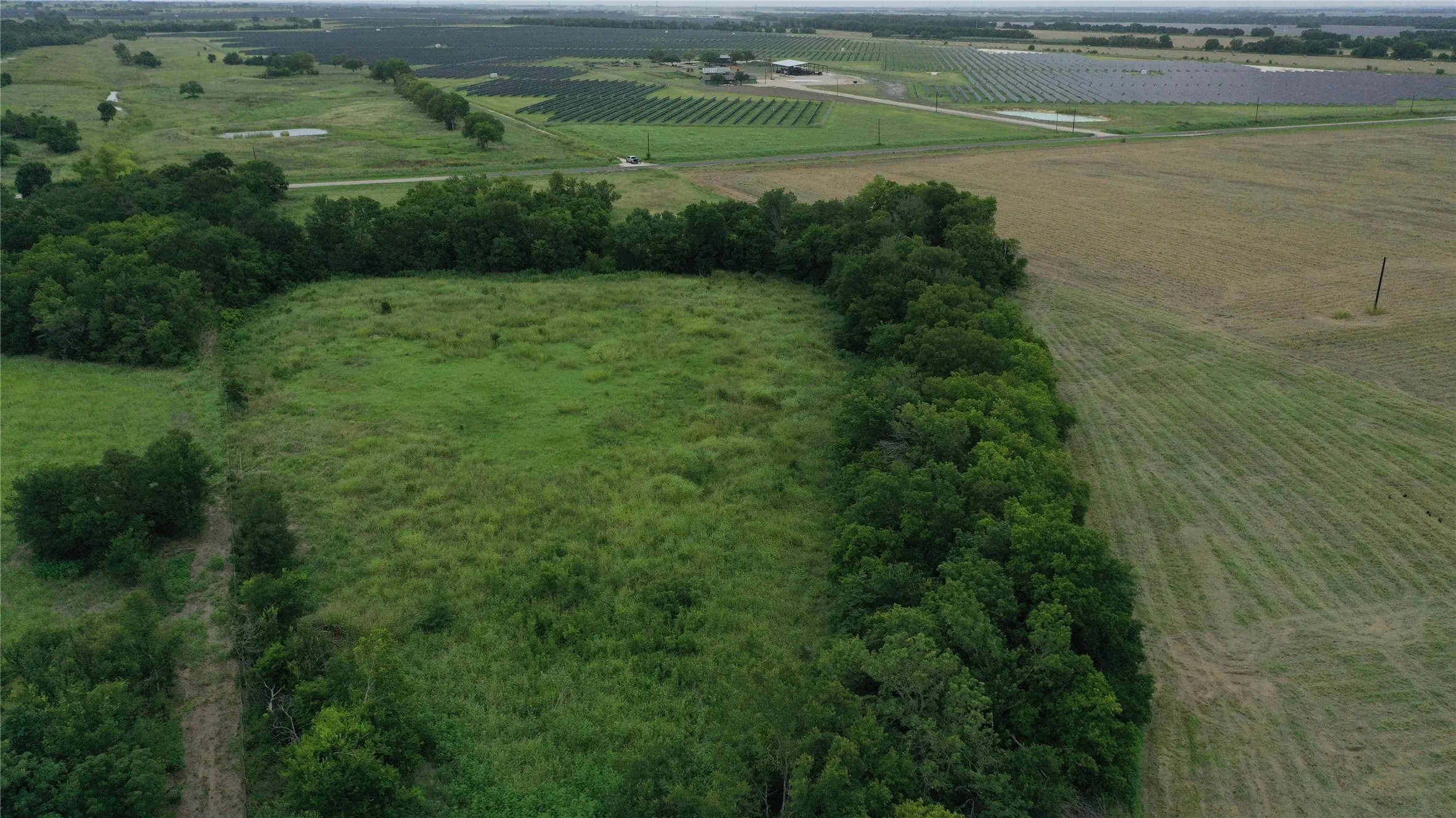 View of property location with large plots for crops and rural landscape