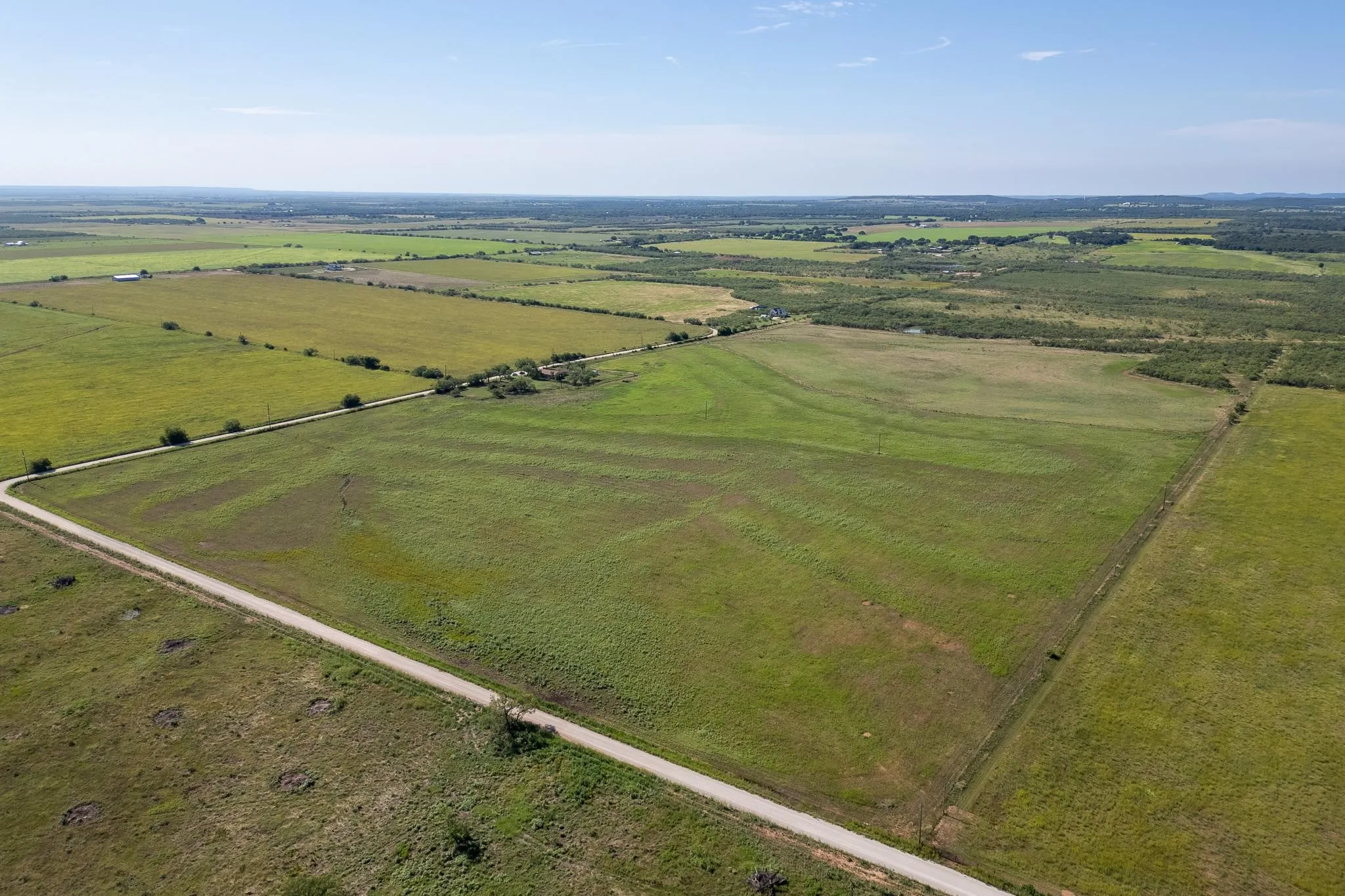Aerial view of property's location with rural landscape