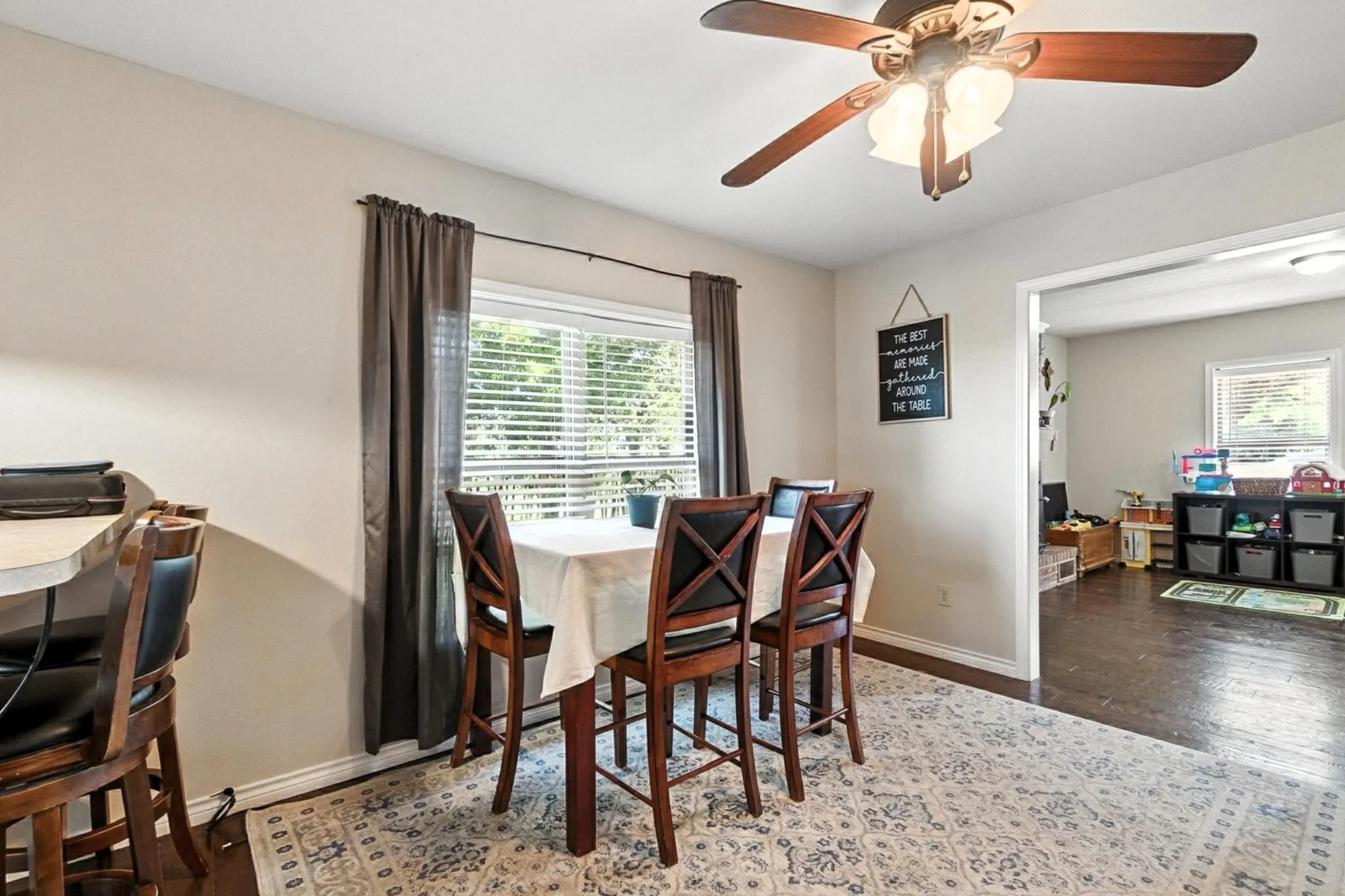 Dining room featuring a ceiling fan and wood finished floors