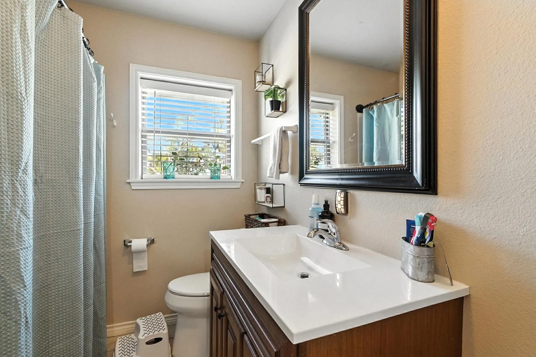 Full bath featuring vanity and toilet