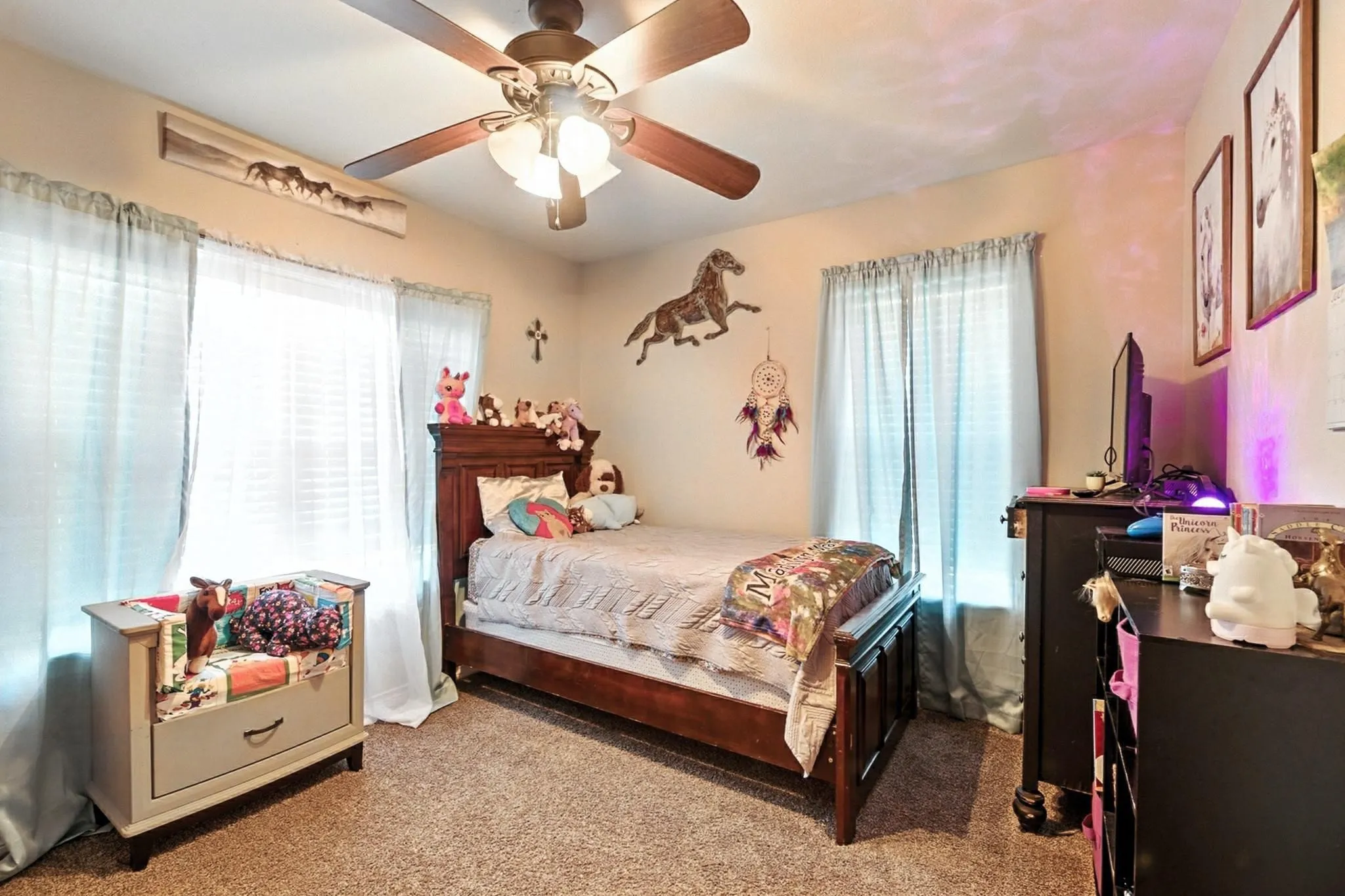 Bedroom featuring carpet and ceiling fan