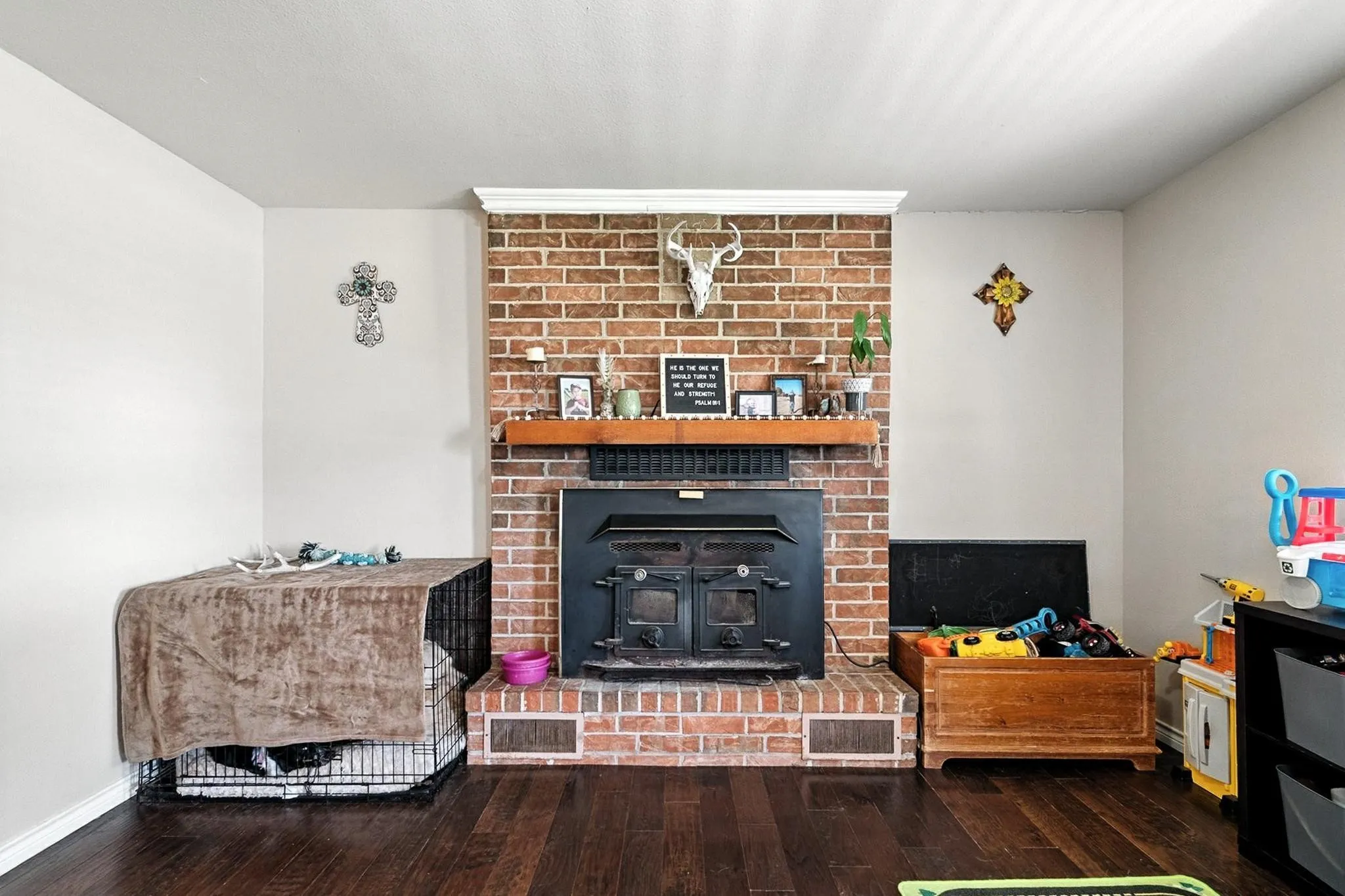 Living room with wood-type flooring and baseboards