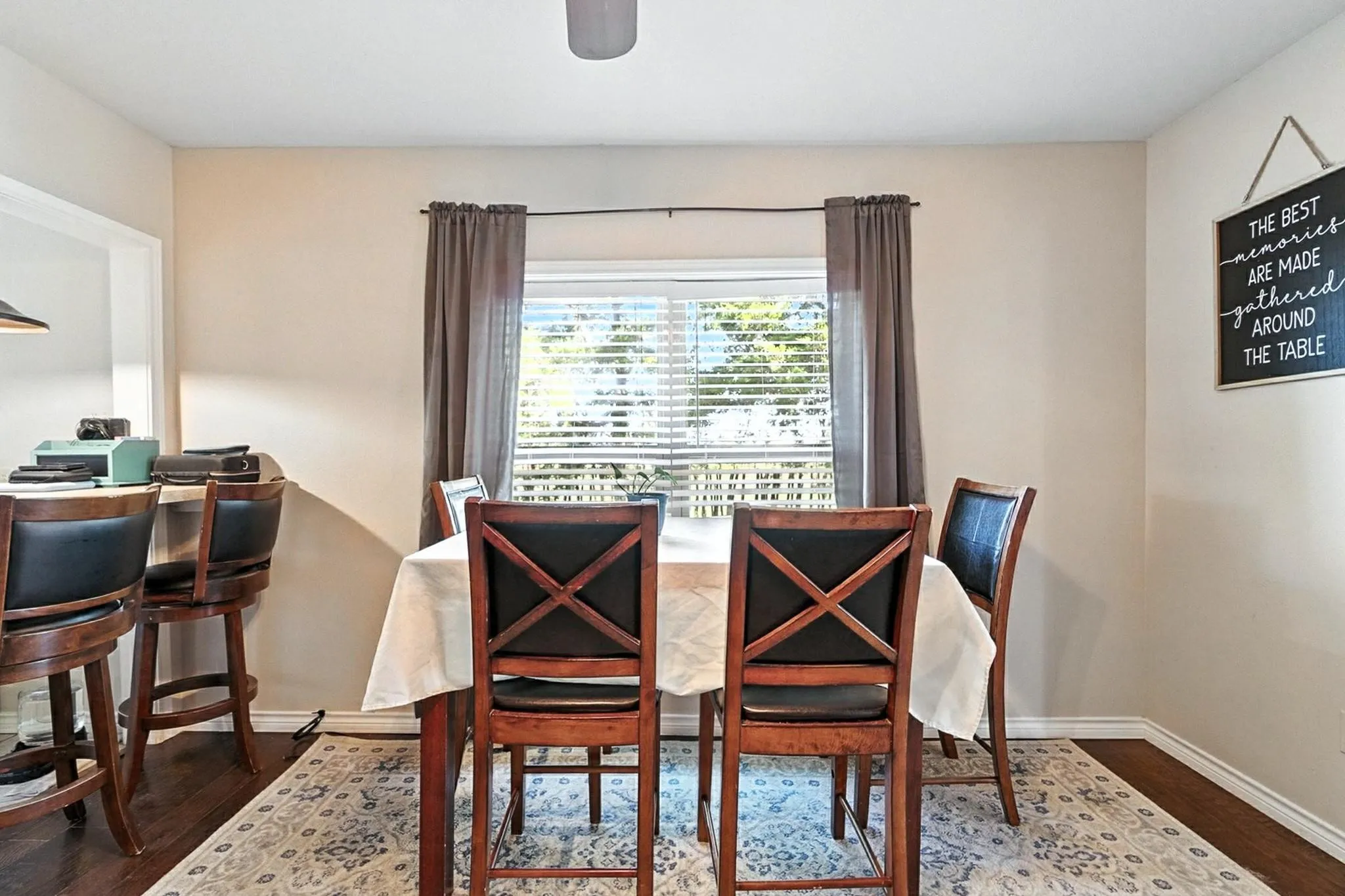 Dining space featuring wood finished floors and baseboards