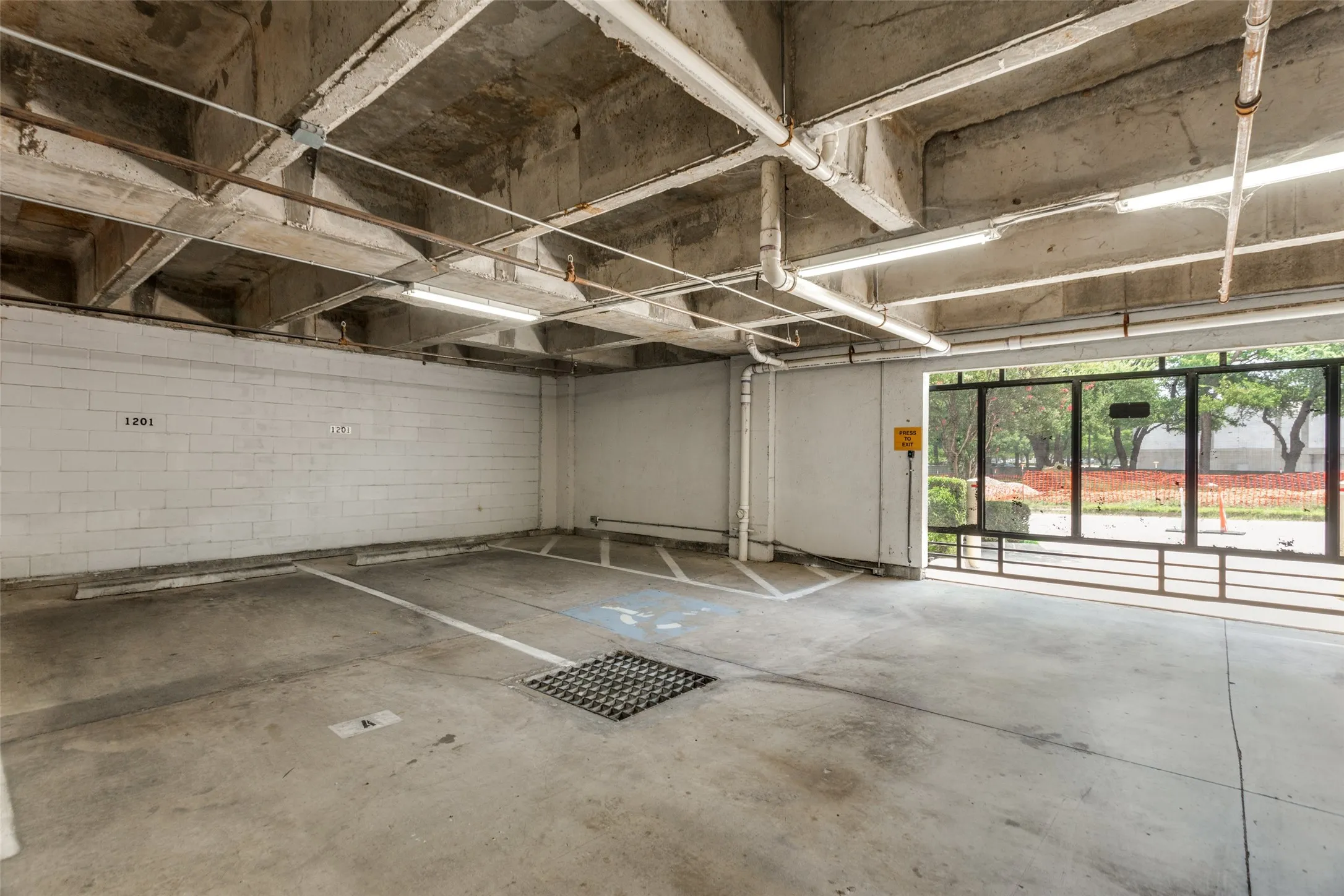These are the 2 parking spaces assigned to the unit as well as a photo of one of the secure entrances.