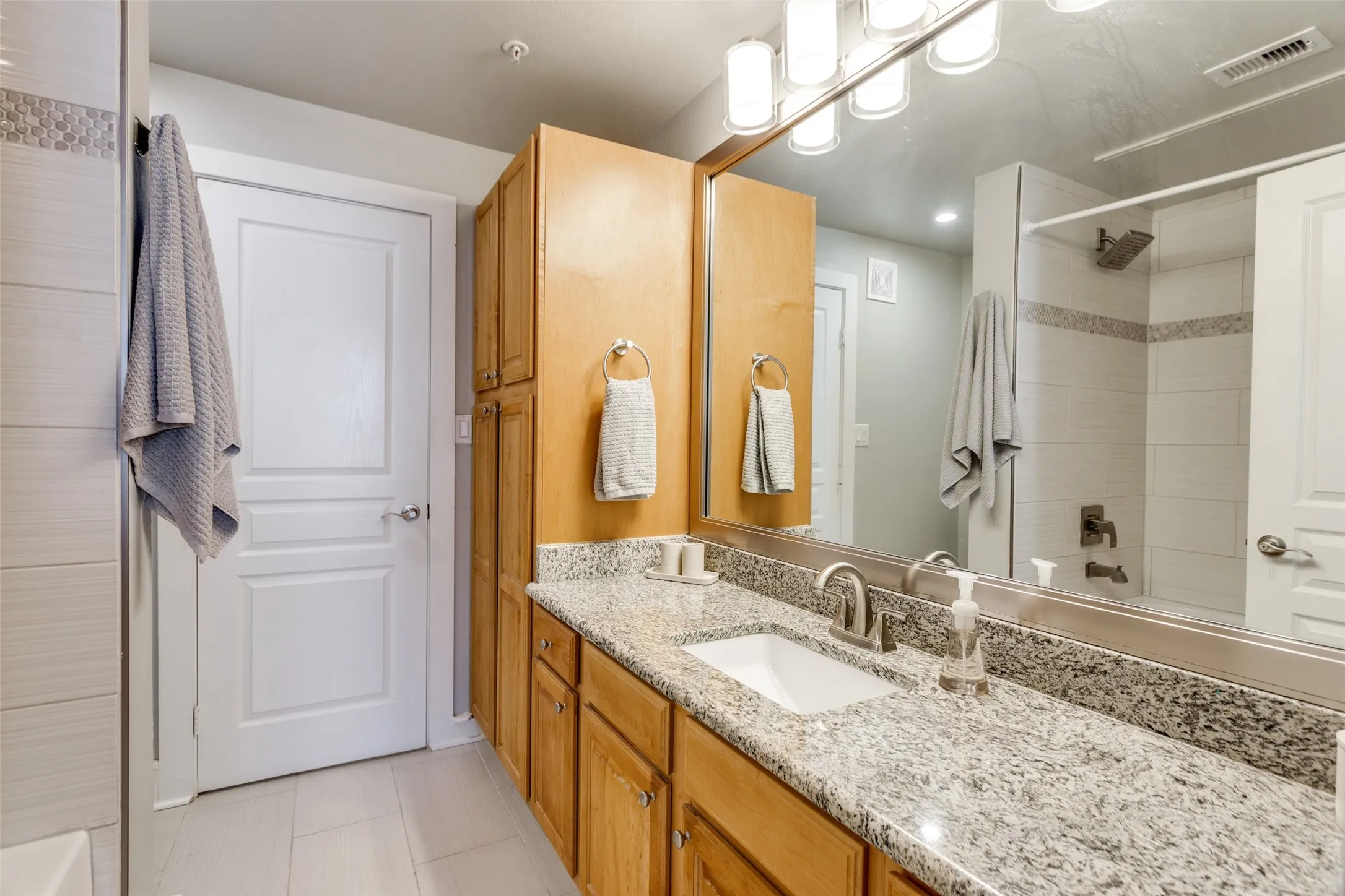 The ensuite bathroom has abundance counter space, a walk-in closet and a tub/shower.