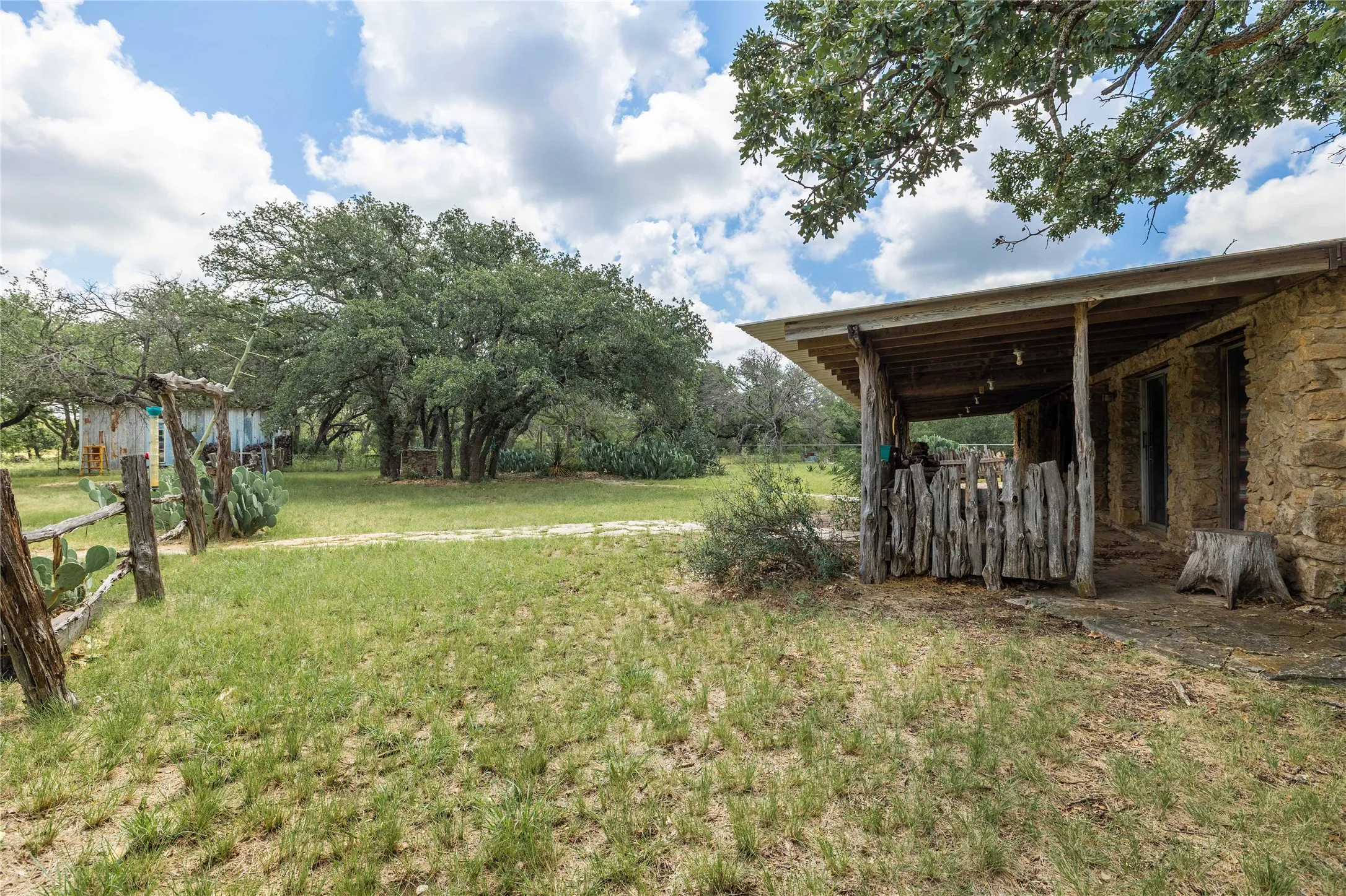 View of green lawn with an outbuilding