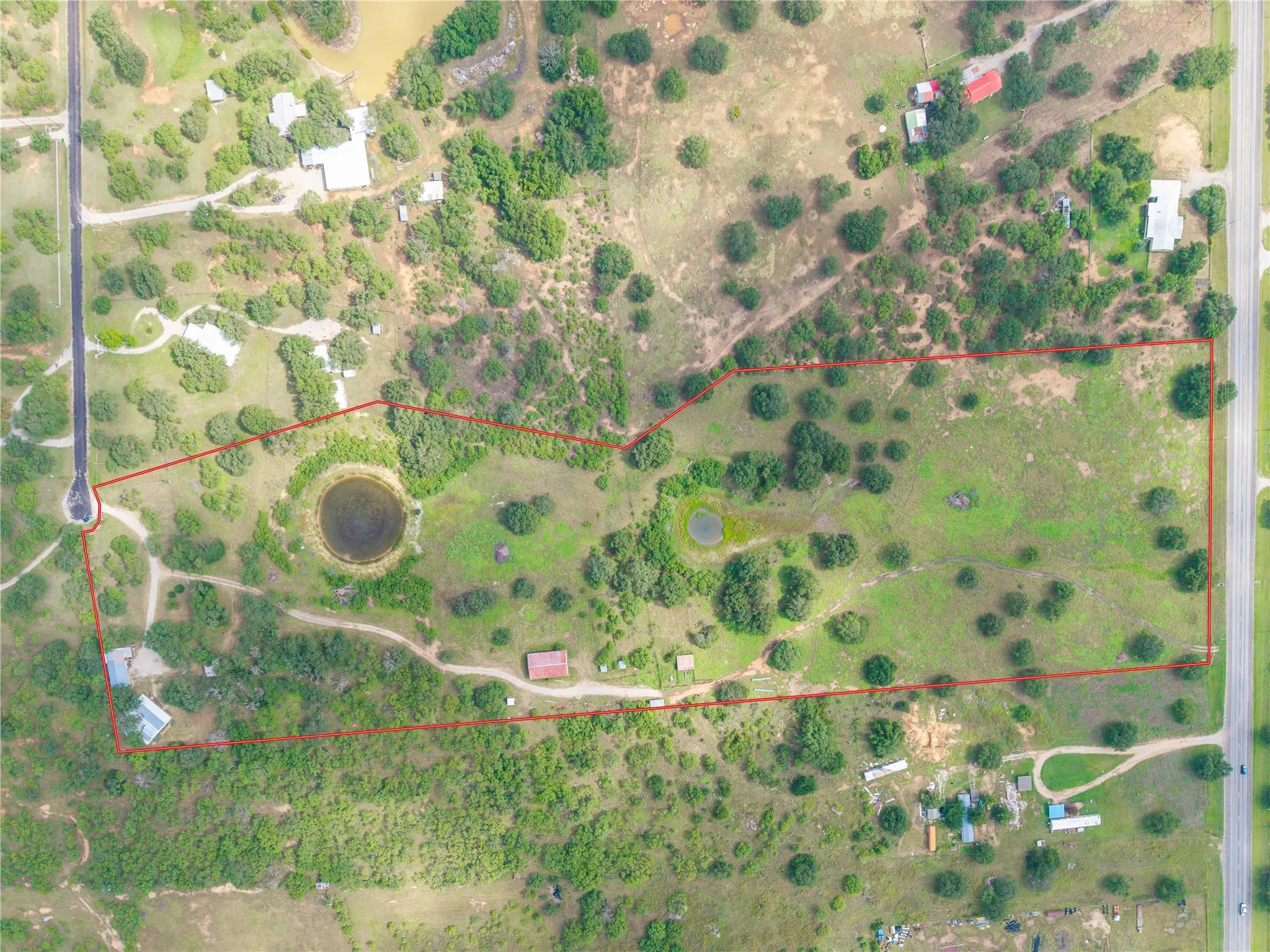 Aerial overview of property's location with property parcel outlined